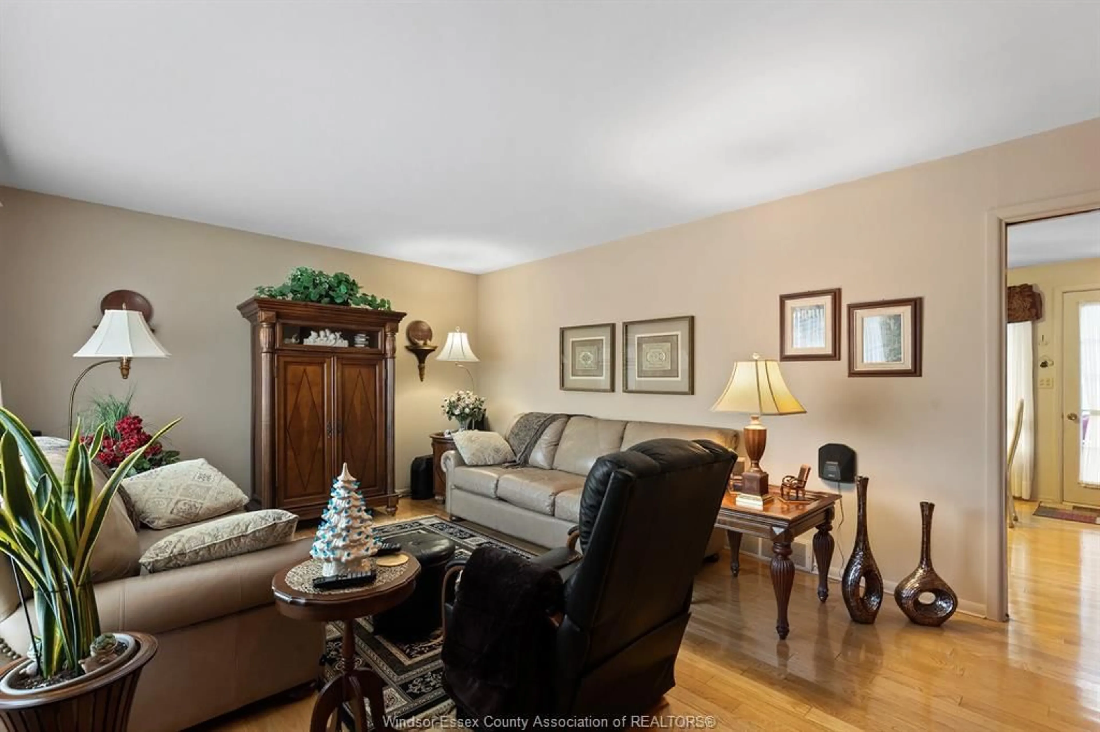 Living room with furniture, wood/laminate floor for 1615 Leduc, Windsor Ontario N9B 1S9