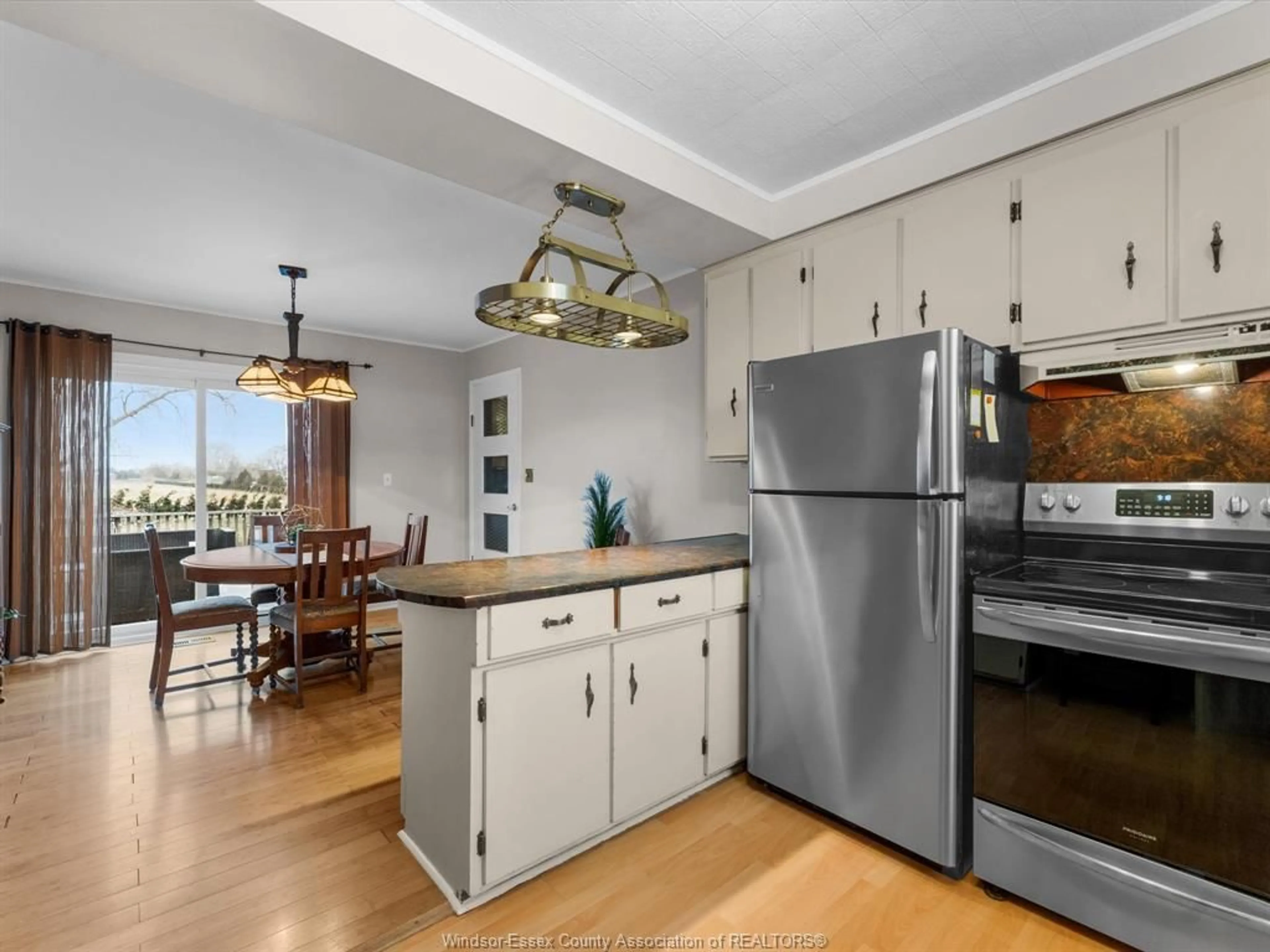 Open concept kitchen, wood/laminate floor for 1175 Highway 77, Leamington Ontario N0P 2J0