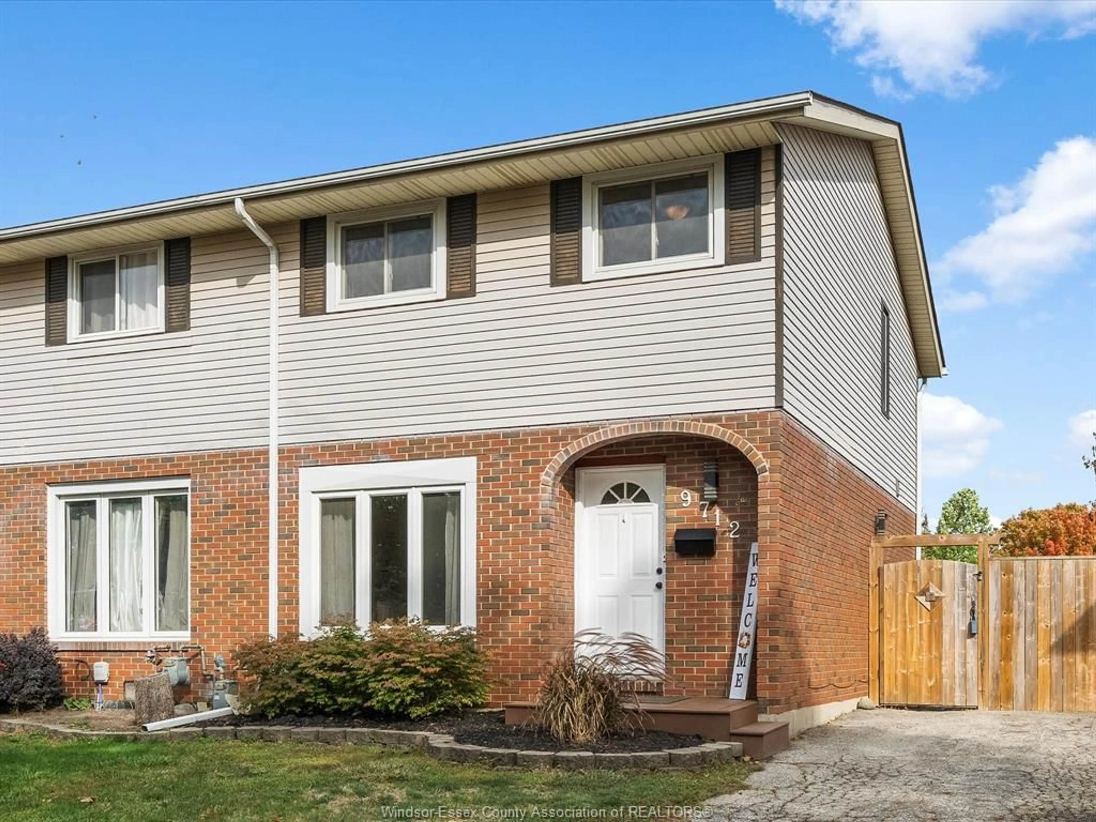 Home with brick exterior material, street for 9712 LYNNGROVE Cres, Windsor Ontario N8R 1B7