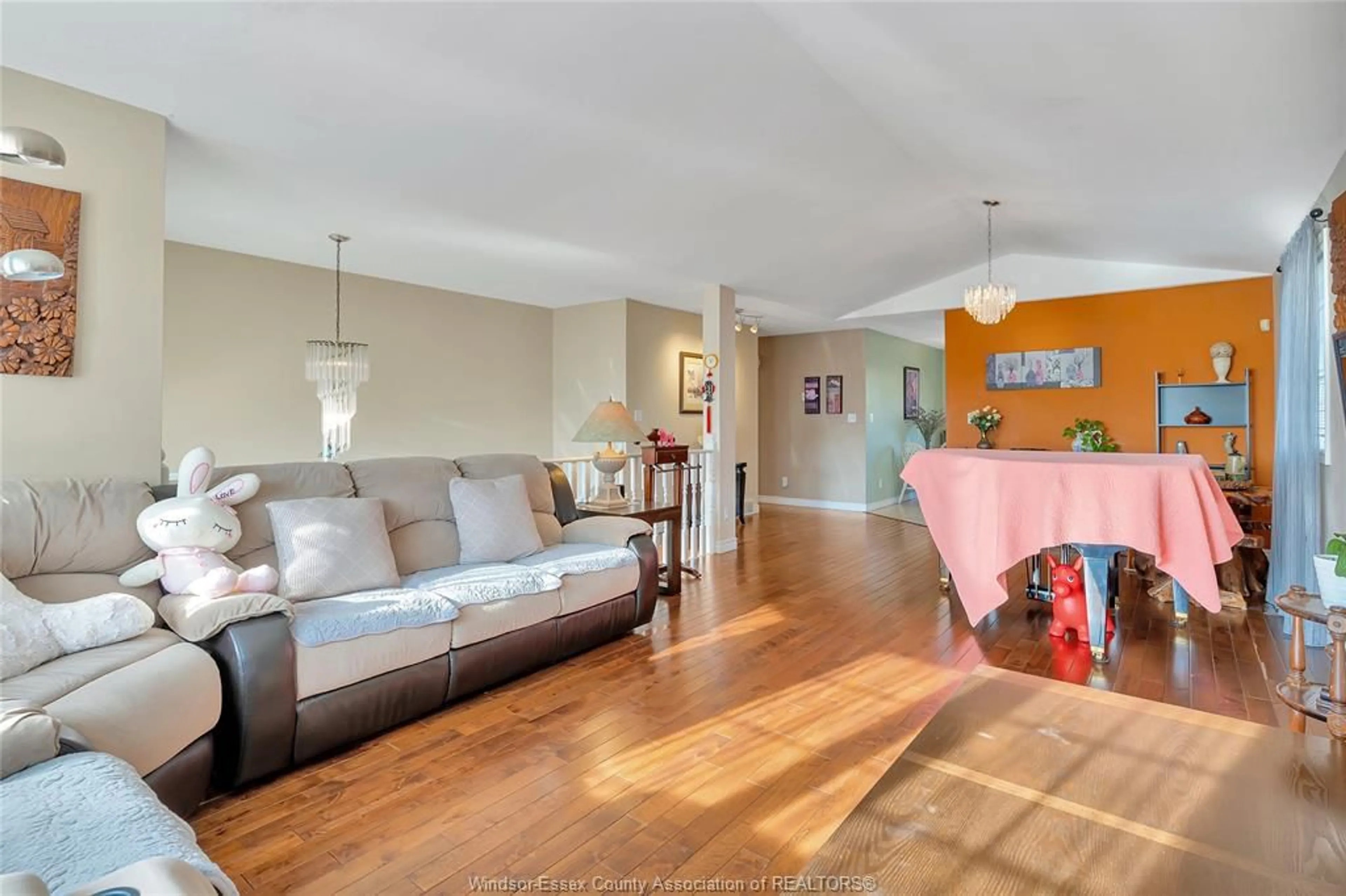 Living room with furniture, wood/laminate floor for 4316 GOLFCOURSE Cres, Windsor Ontario N9G 2P4