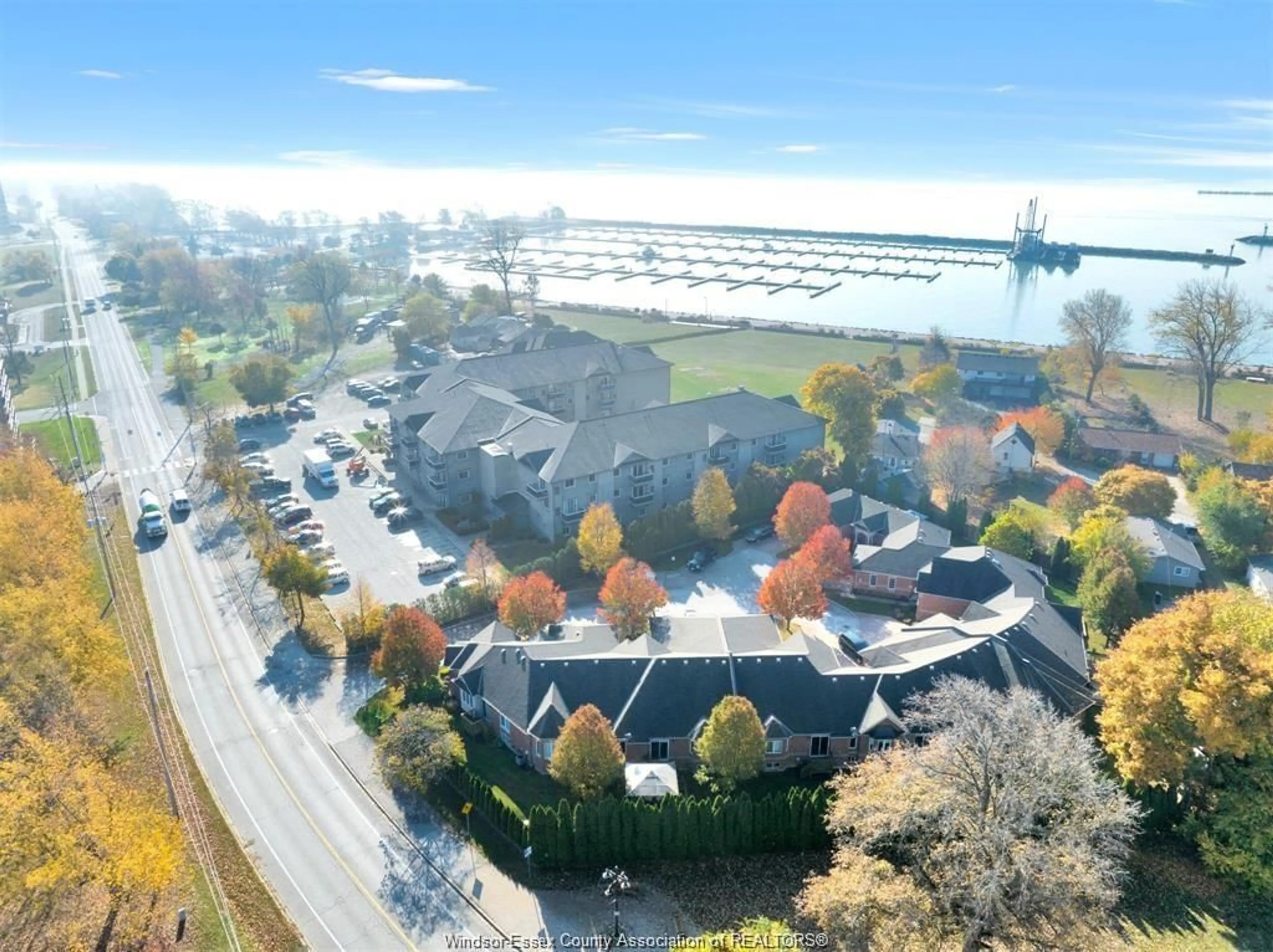 A pic from outside/outdoor area/front of a property/back of a property/a pic from drone, water/lake/river/ocean view for 32 ROBSON #7, Leamington Ontario N8H 2M9