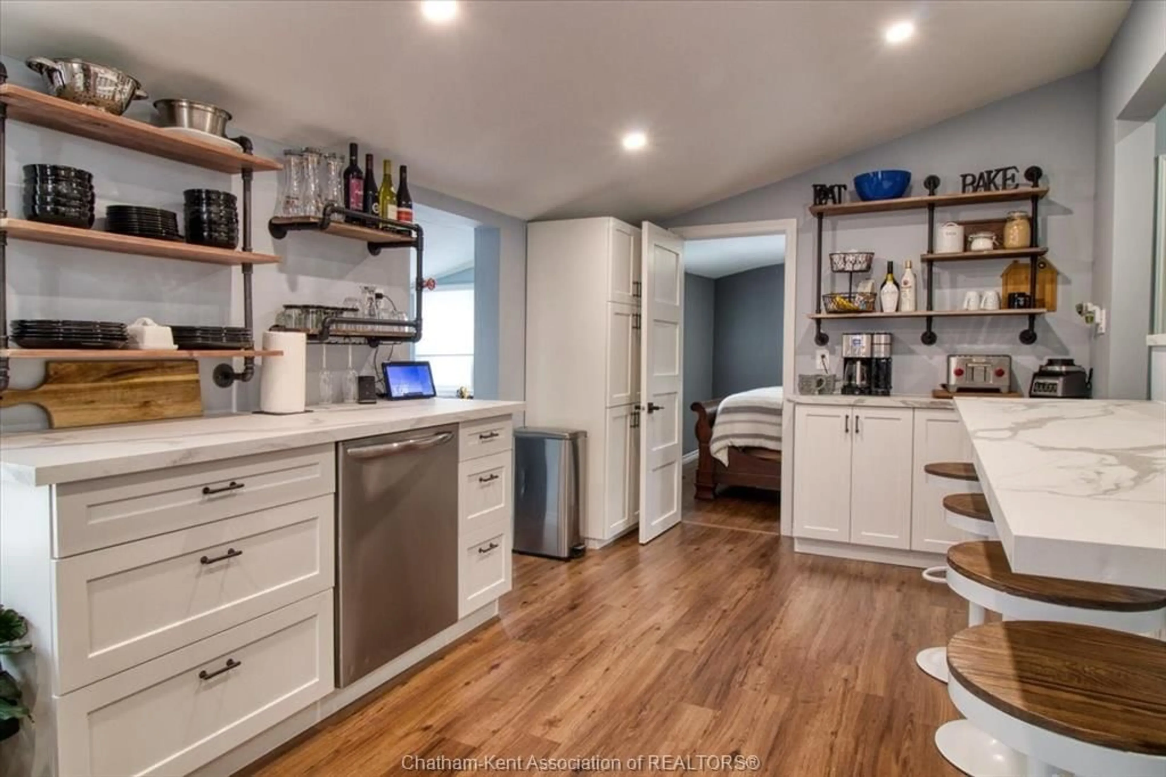 Open concept kitchen, wood/laminate floor for 36 O'Neil St, Chatham Ontario N7M 3A3