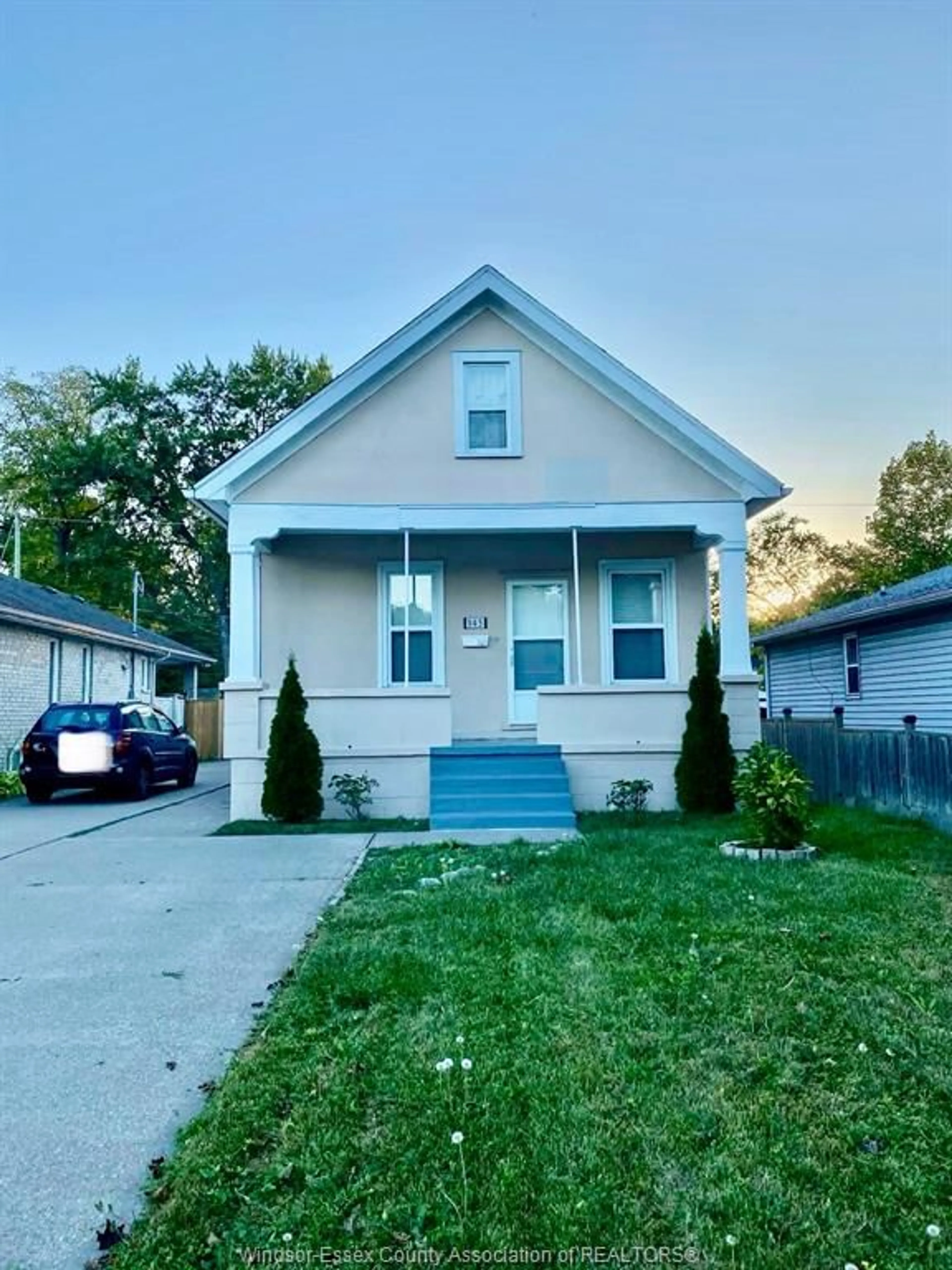 Home with vinyl exterior material, street for 943 LAUZON Rd, Windsor Ontario N8S 3M4