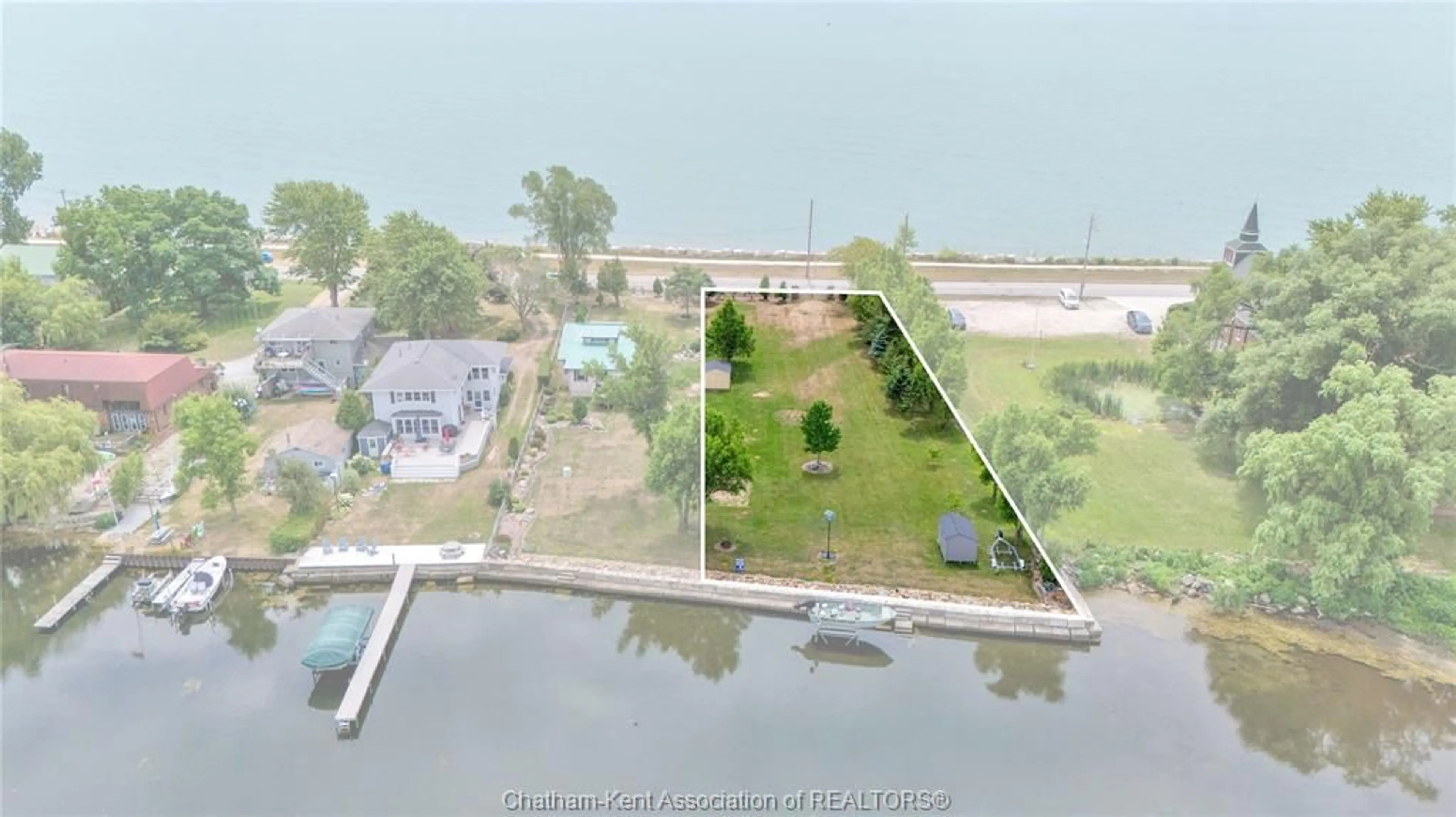 A pic from outside/outdoor area/front of a property/back of a property/a pic from drone, water/lake/river/ocean view for 100 ROSS Lane, Erieau Ontario N0P 1N0