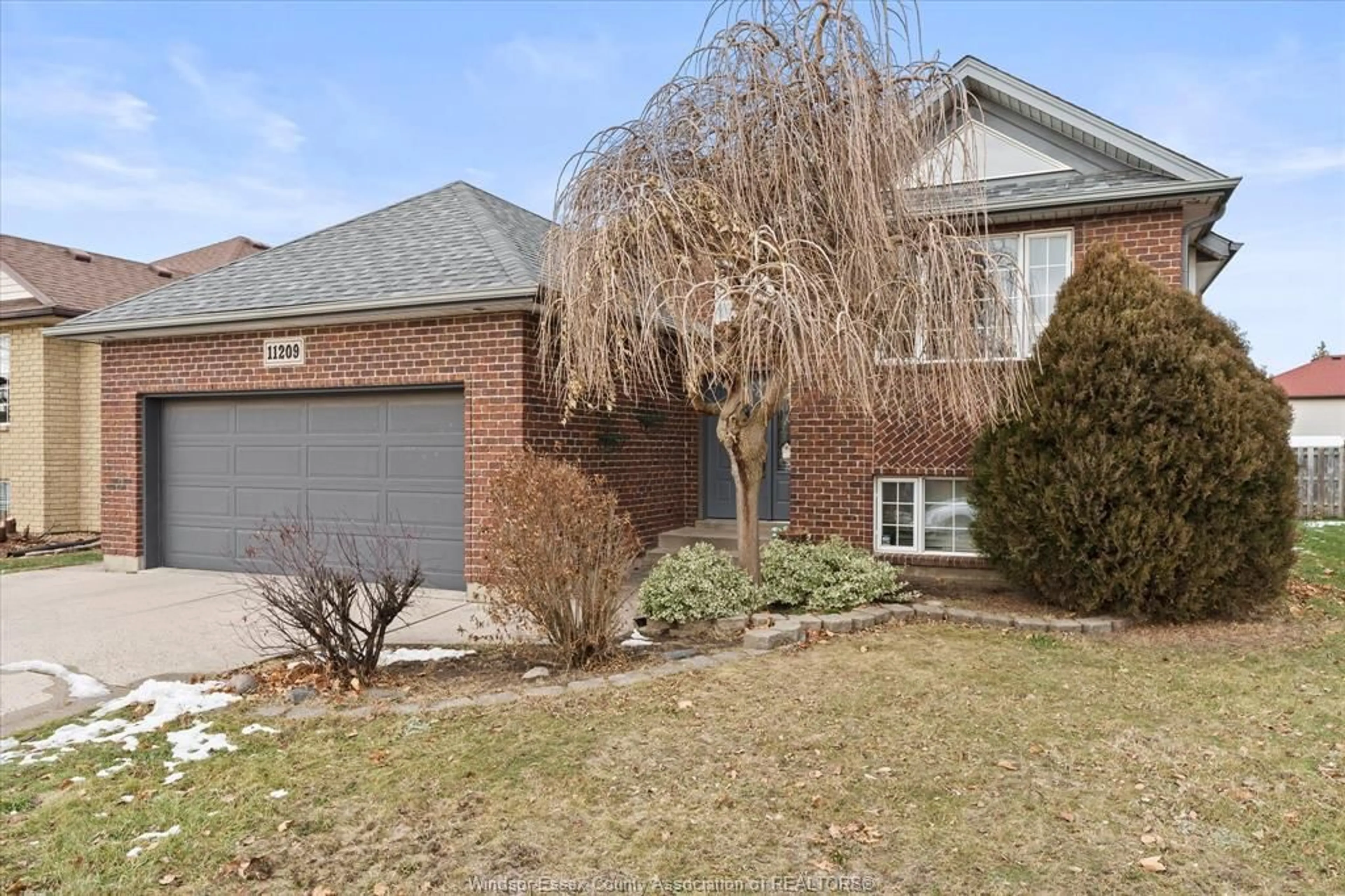 Home with brick exterior material, street for 11209 ANCONA Cres, Windsor Ontario N8R 2K2