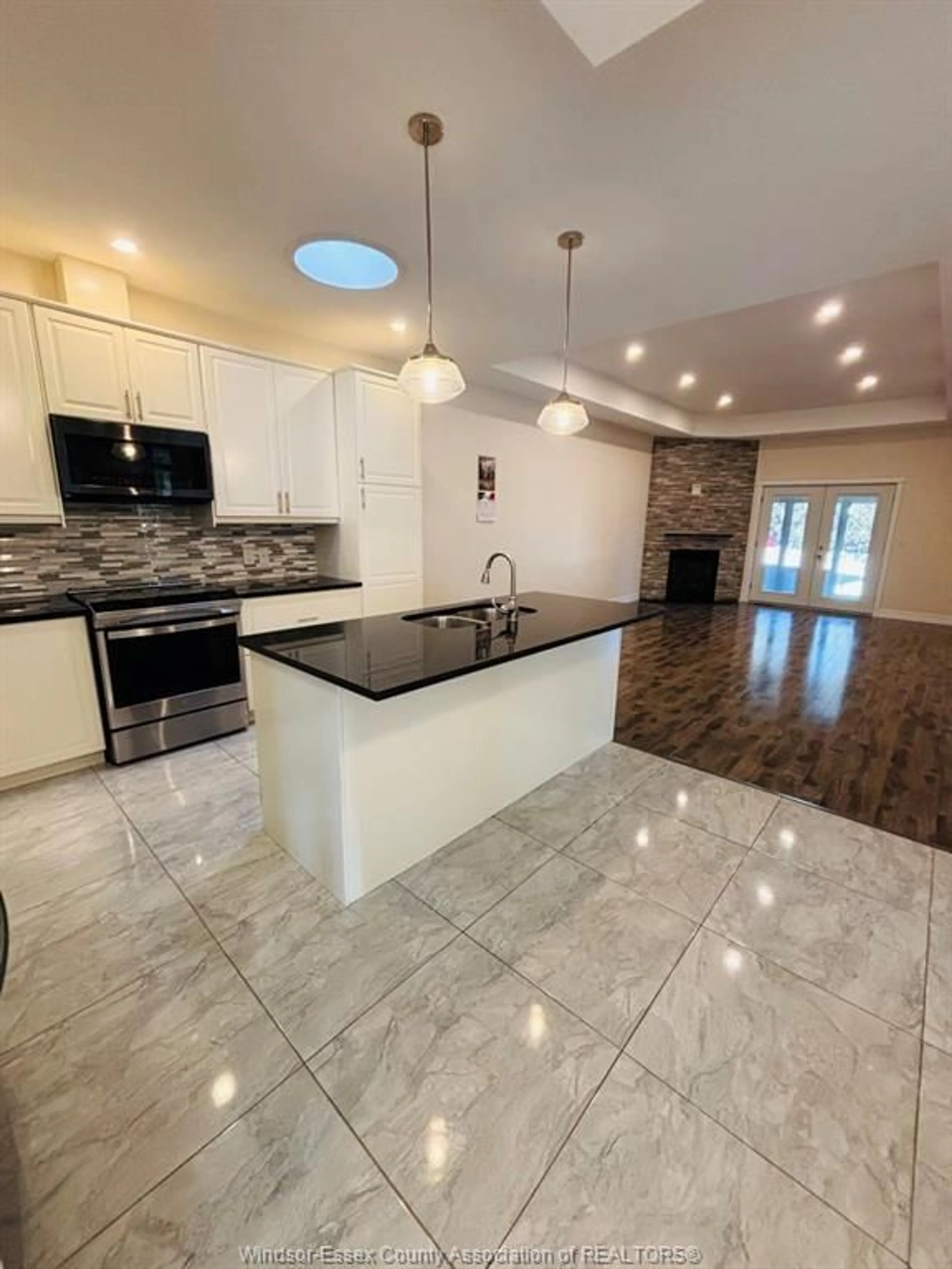 Open concept kitchen, ceramic/tile floor for 21 BABKIRK Lane, Leamington Ontario N8H 0A1