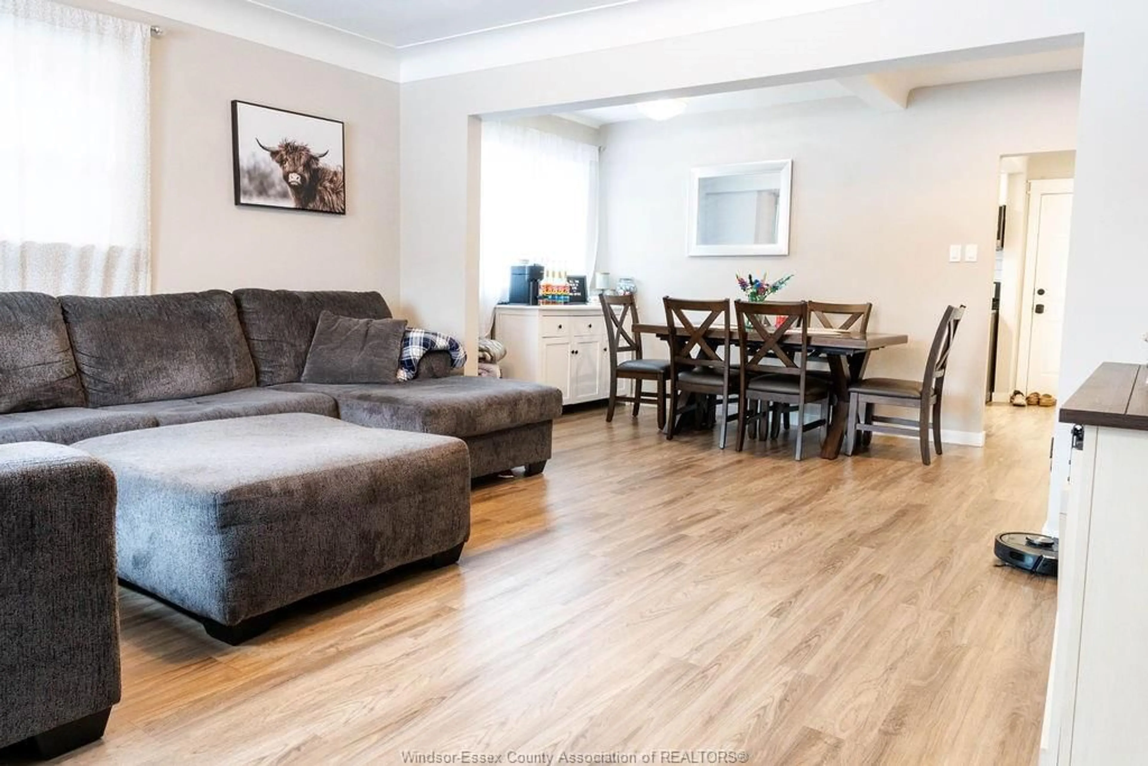 Living room with furniture, wood/laminate floor for 2334 Highland, Windsor Ontario N8X 3S5