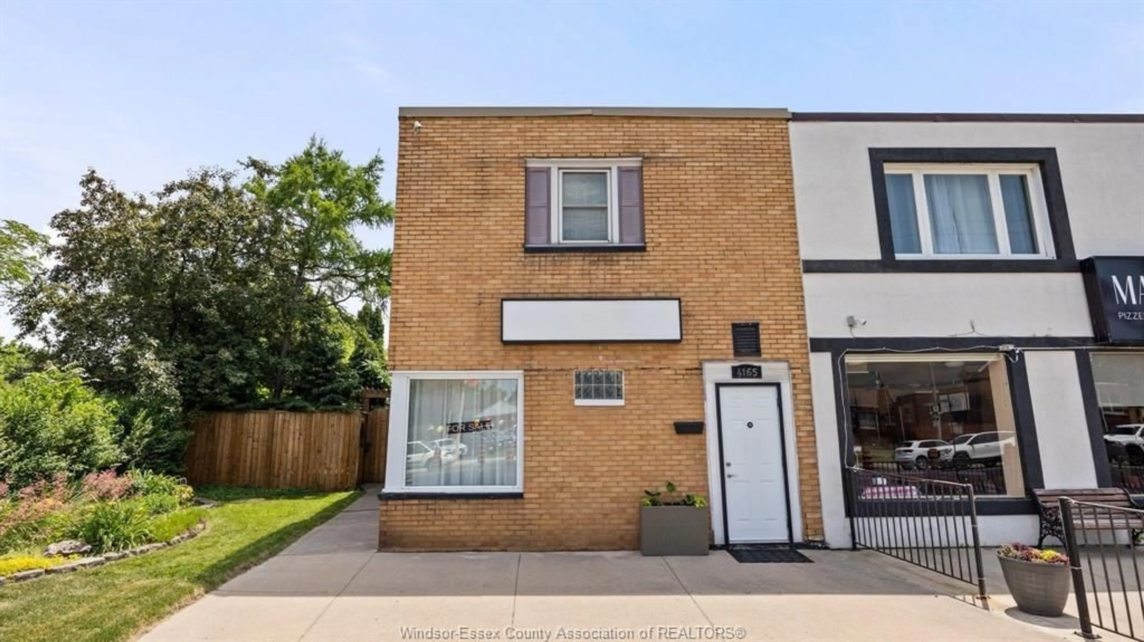 Home with brick exterior material, street for 4165 TECUMSEH Rd, Windsor Ontario N8W 1J9