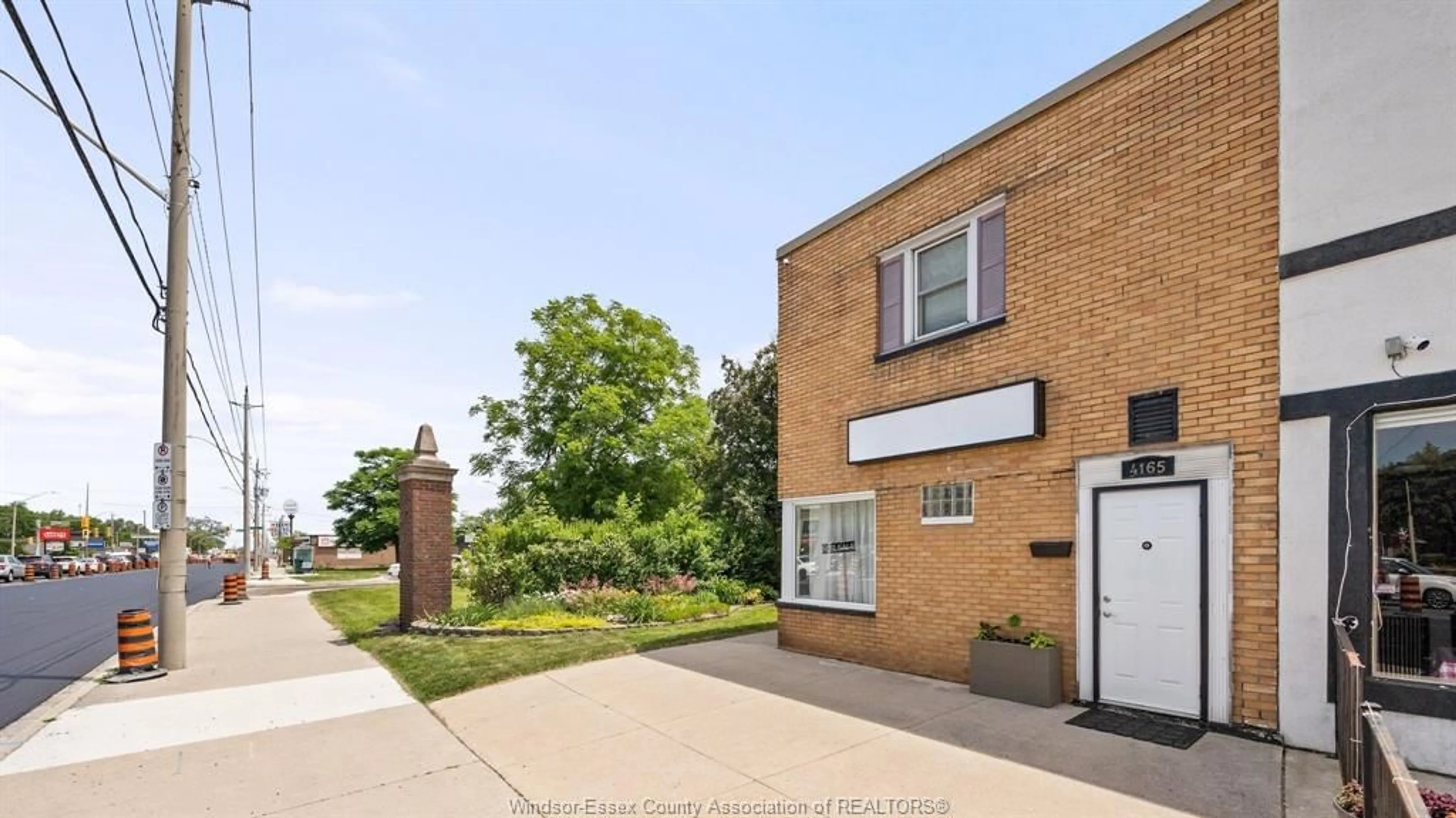 Home with brick exterior material, street for 4165 TECUMSEH Rd, Windsor Ontario N8W 1J9