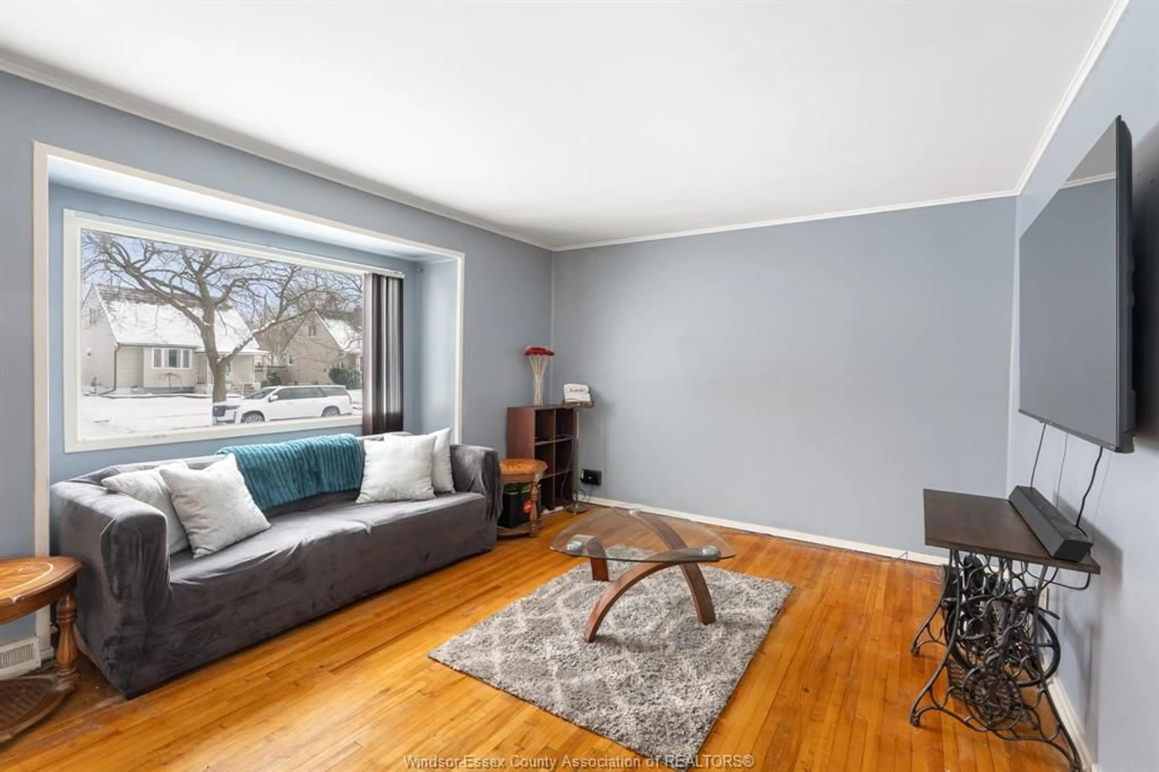 Living room with furniture, wood/laminate floor for 1883 LARKIN RD, Windsor Ontario N8W 4G7