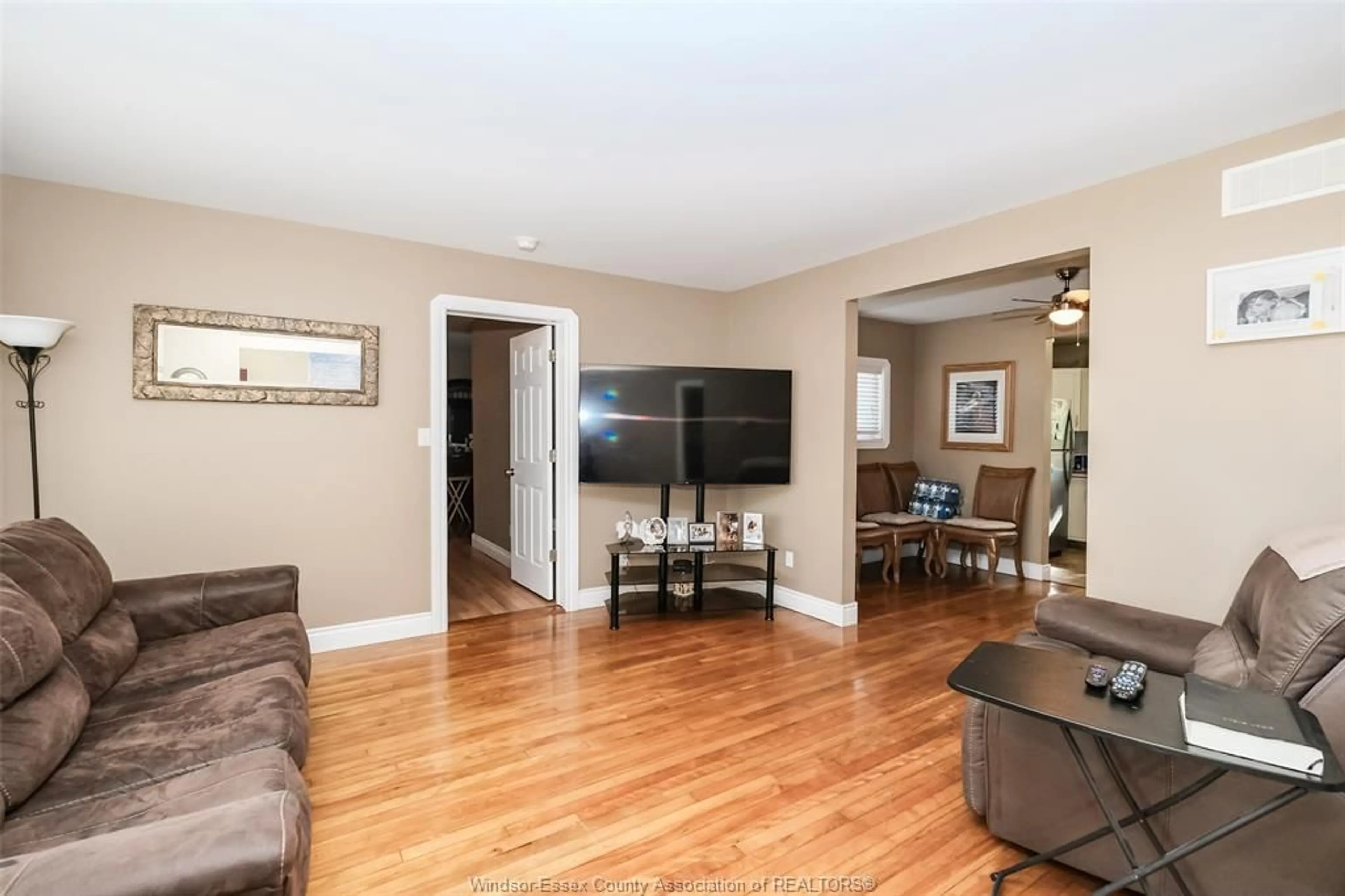 Living room with furniture, wood/laminate floor for 1617 MARK Ave, Windsor Ontario N9B 3G5
