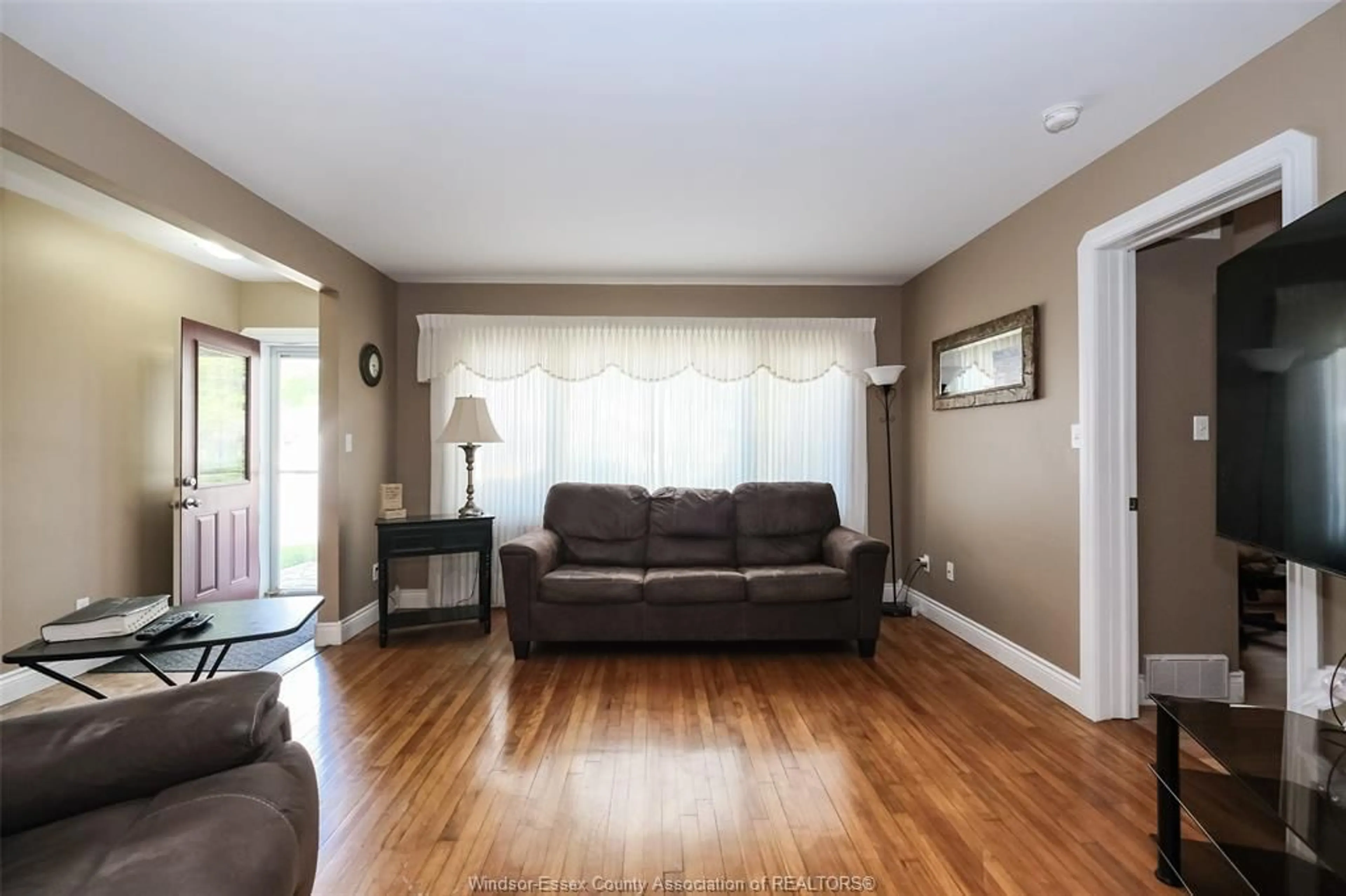 Living room with furniture, wood/laminate floor for 1617 MARK Ave, Windsor Ontario N9B 3G5