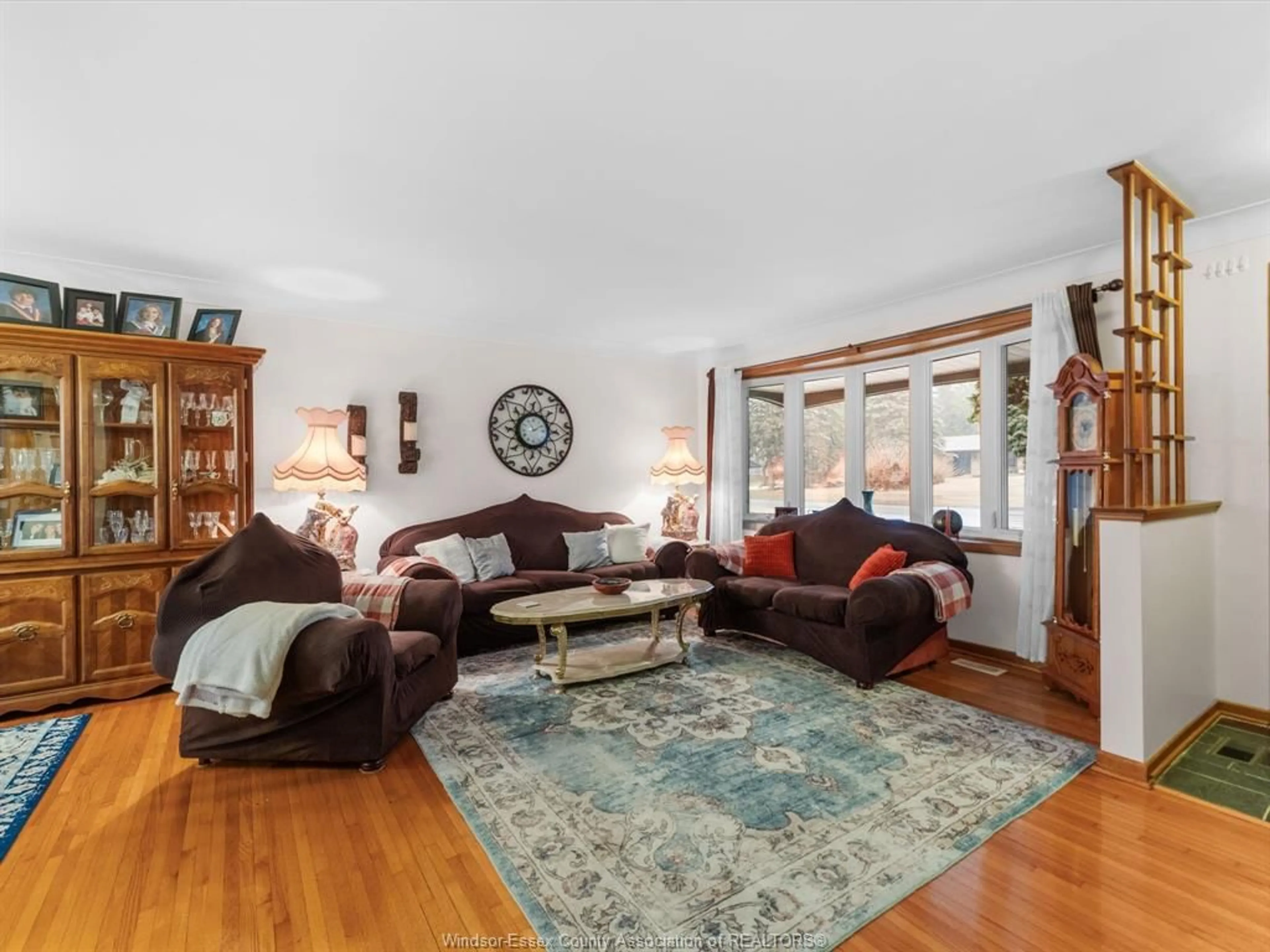 Living room with furniture, wood/laminate floor for 1925 TODD LANE, LaSalle Ontario N9H 1J6