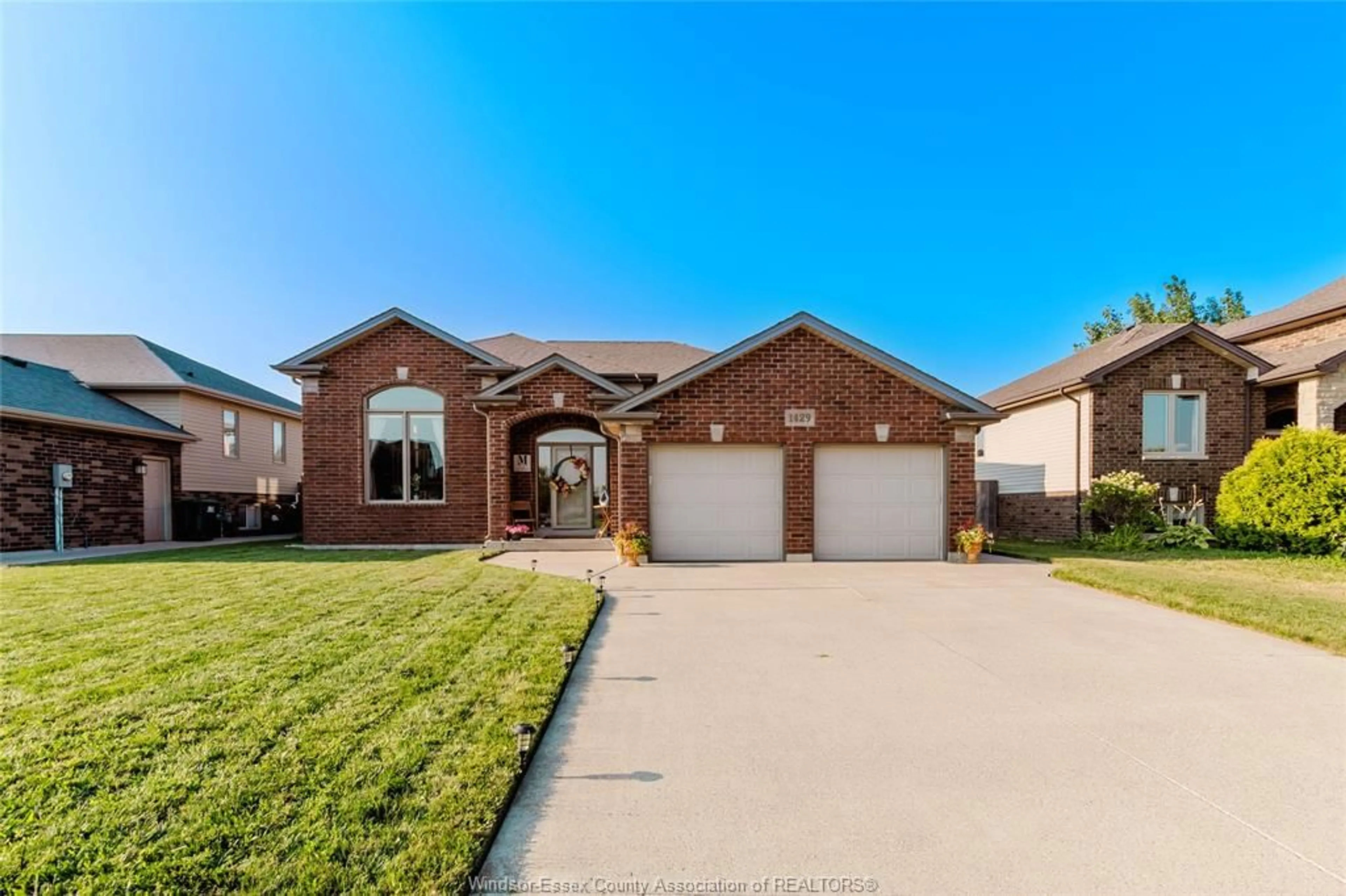 Home with brick exterior material, street for 1429 OAKWOOD Ave, Lakeshore Ontario N8L 0S4