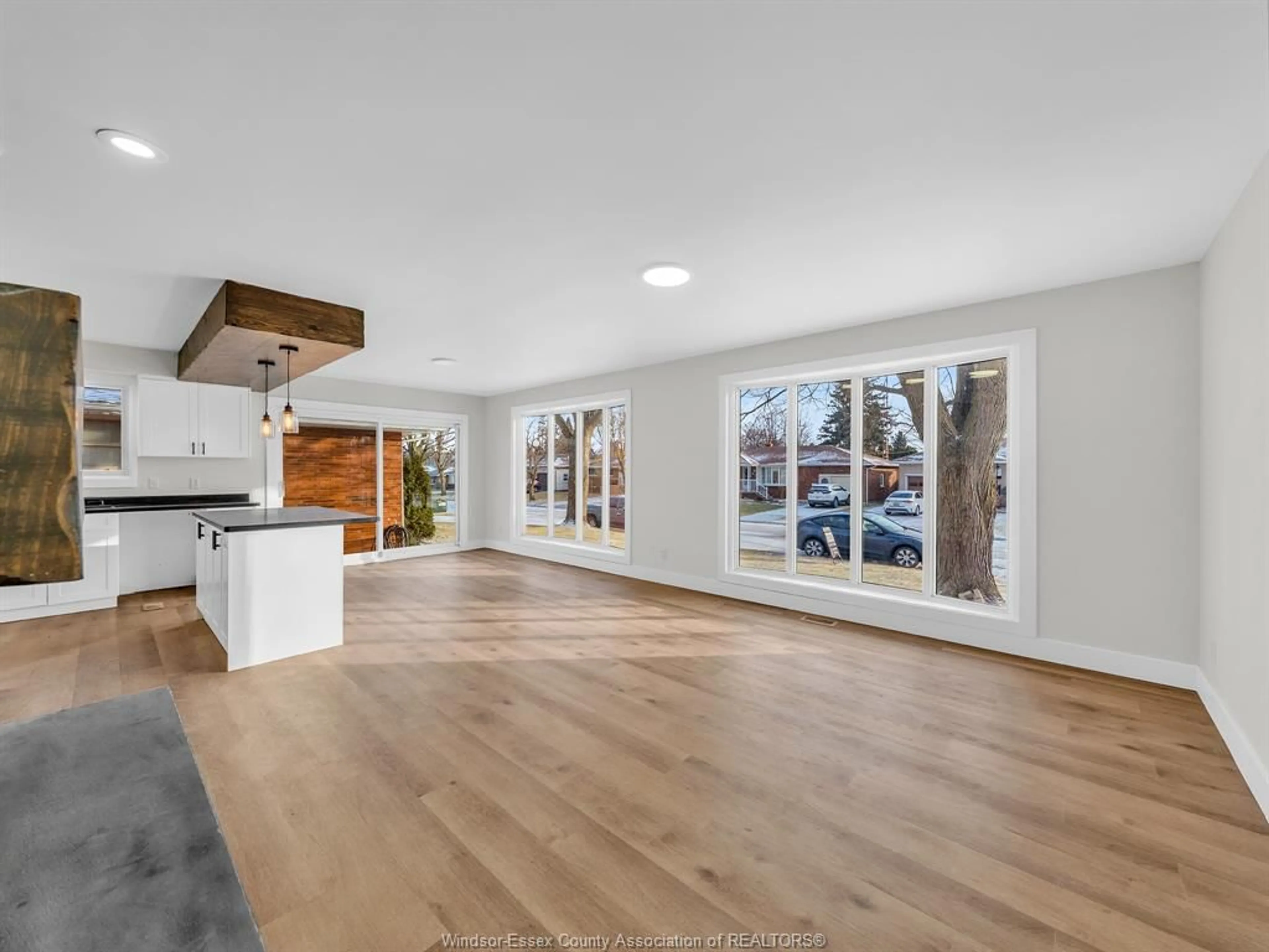 Open concept kitchen, wood/laminate floor for 15 Longfield Lane, Leamington Ontario N8H 2R2