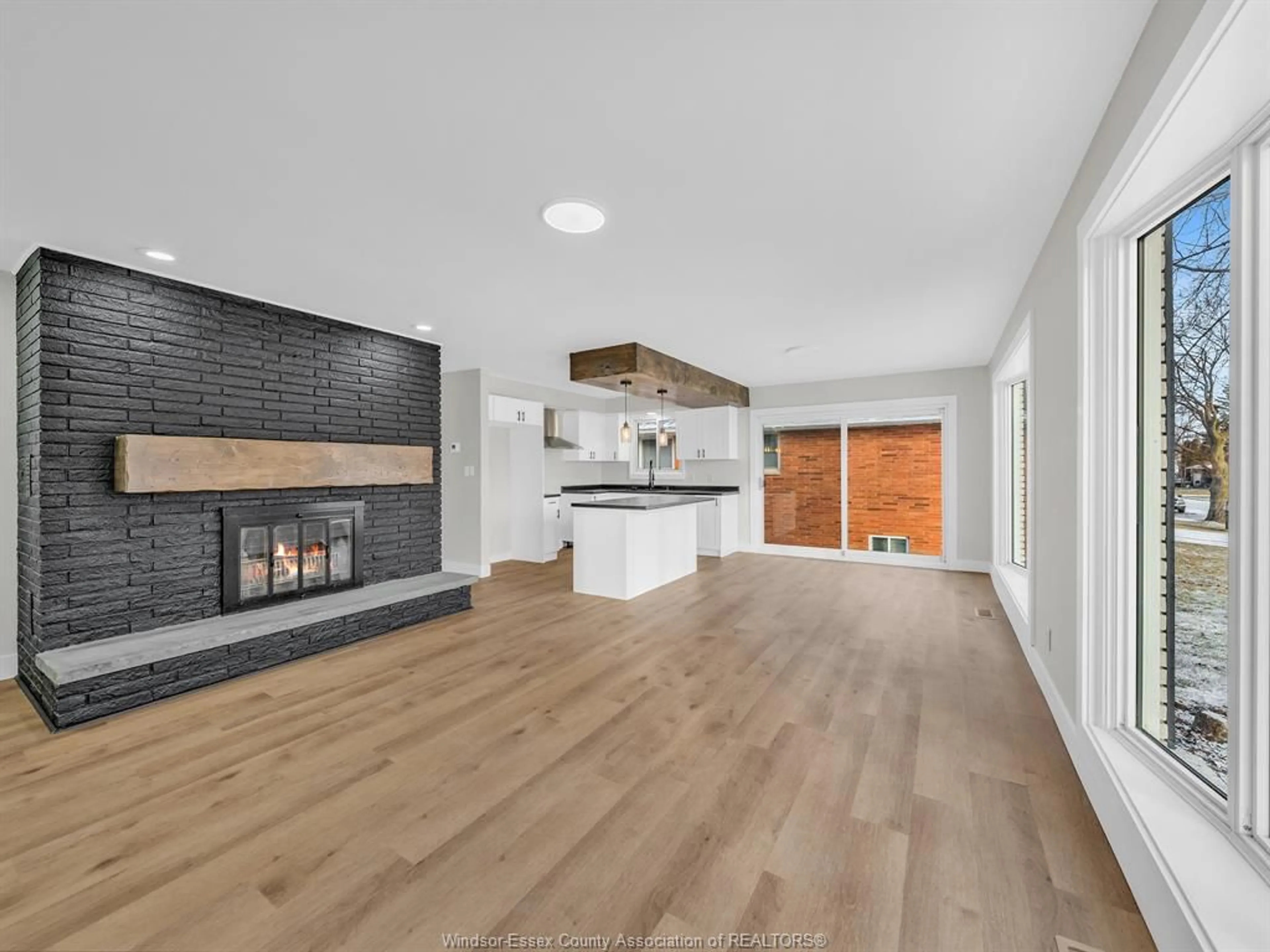 Open concept kitchen, wood/laminate floor for 15 Longfield Lane, Leamington Ontario N8H 2R2