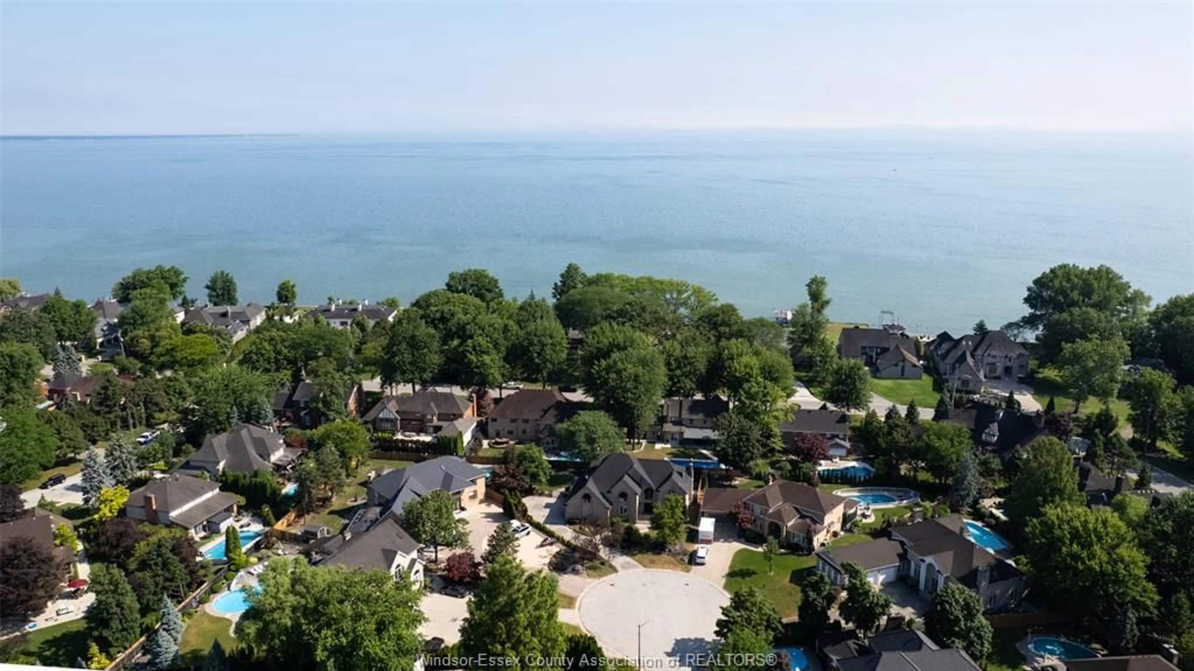 A pic from outside/outdoor area/front of a property/back of a property/a pic from drone, water/lake/river/ocean view for 15 Fasan Cres, Tecumseh Ontario N8N 4L1