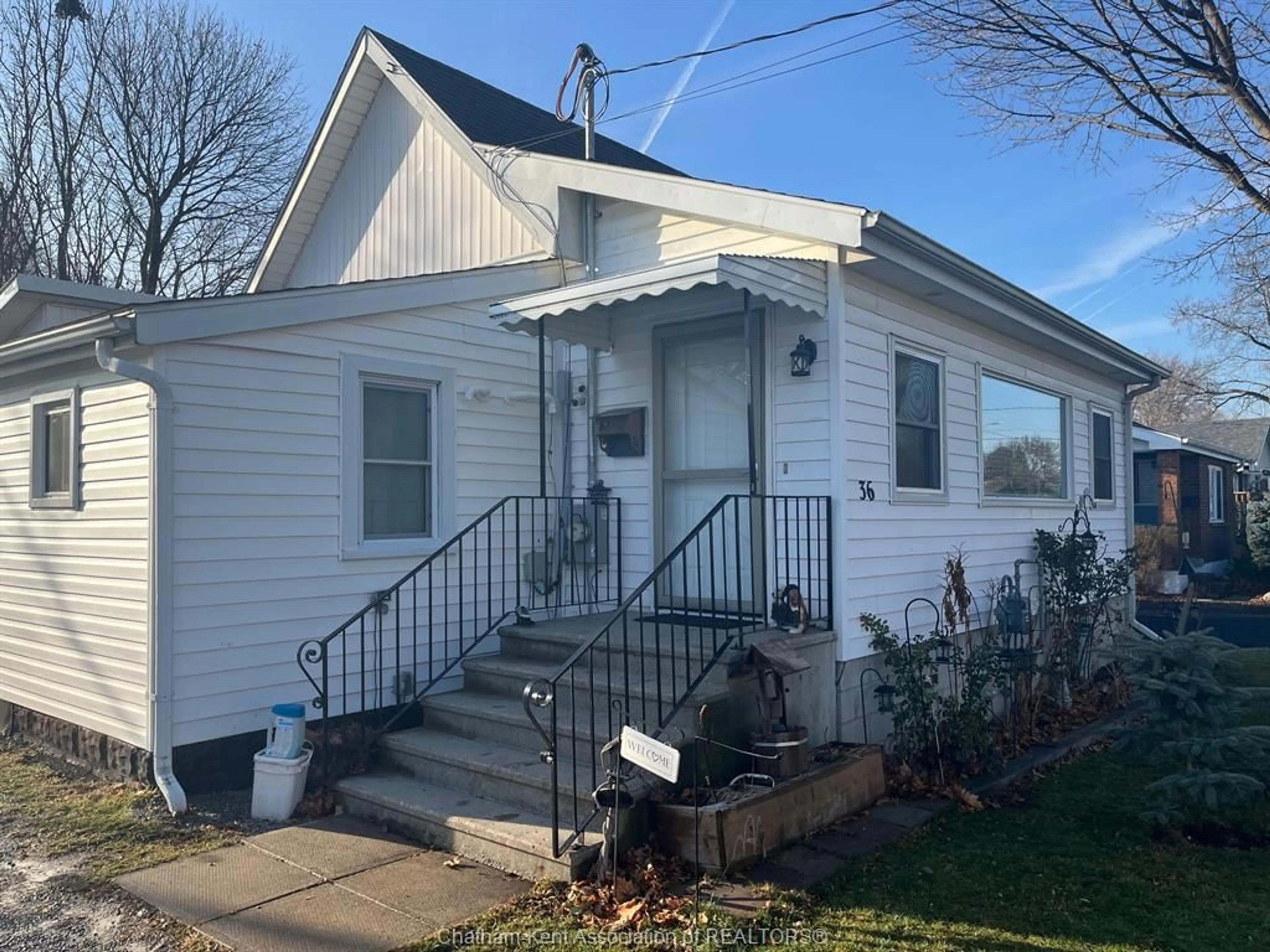 Home with vinyl exterior material, street for 36 O'Neil St, Chatham Ontario N7M 3A3