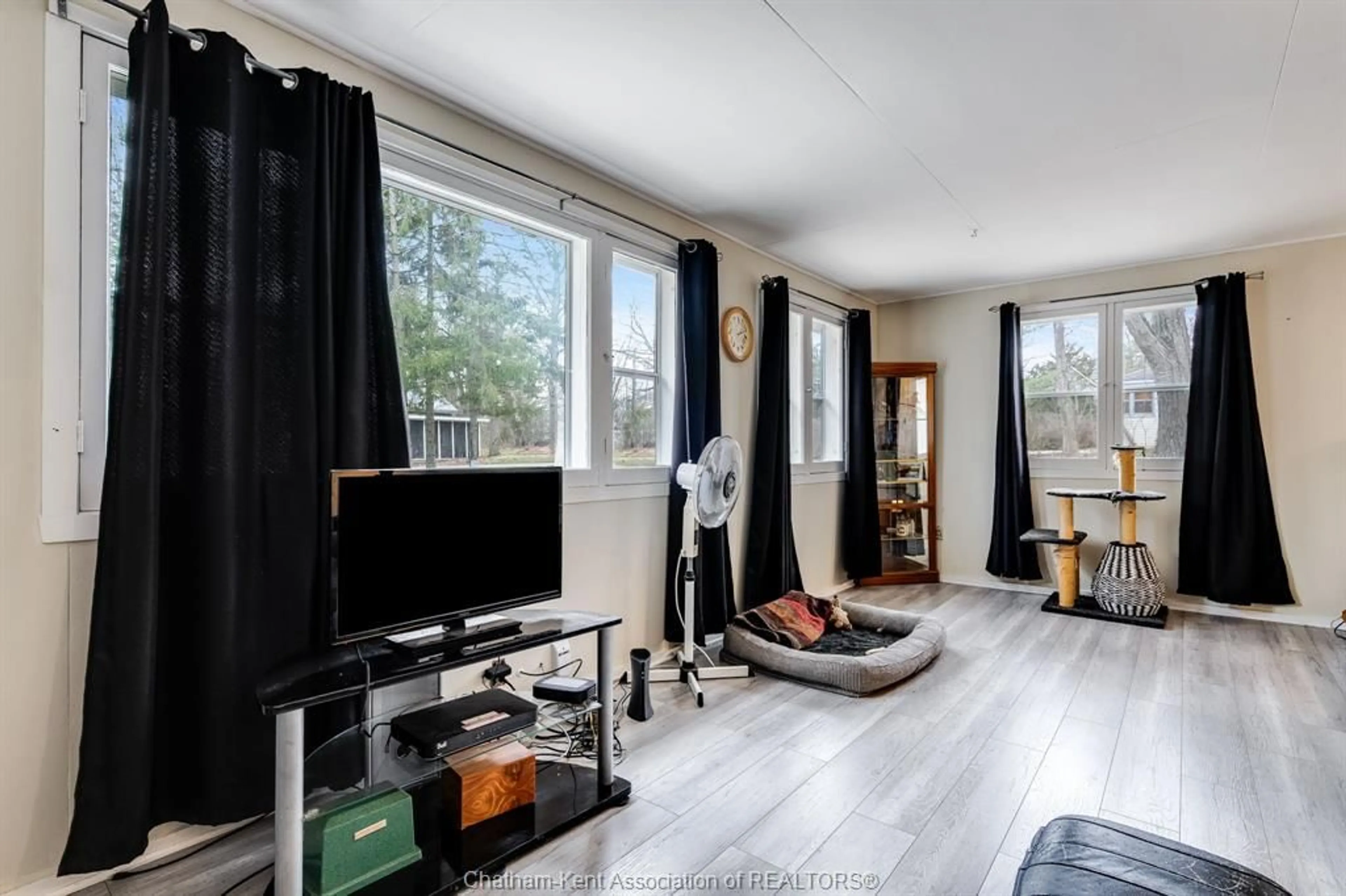 Living room with furniture, wood/laminate floor for 11373 Bowman Ave, Rondeau Park Ontario N0P 1X0