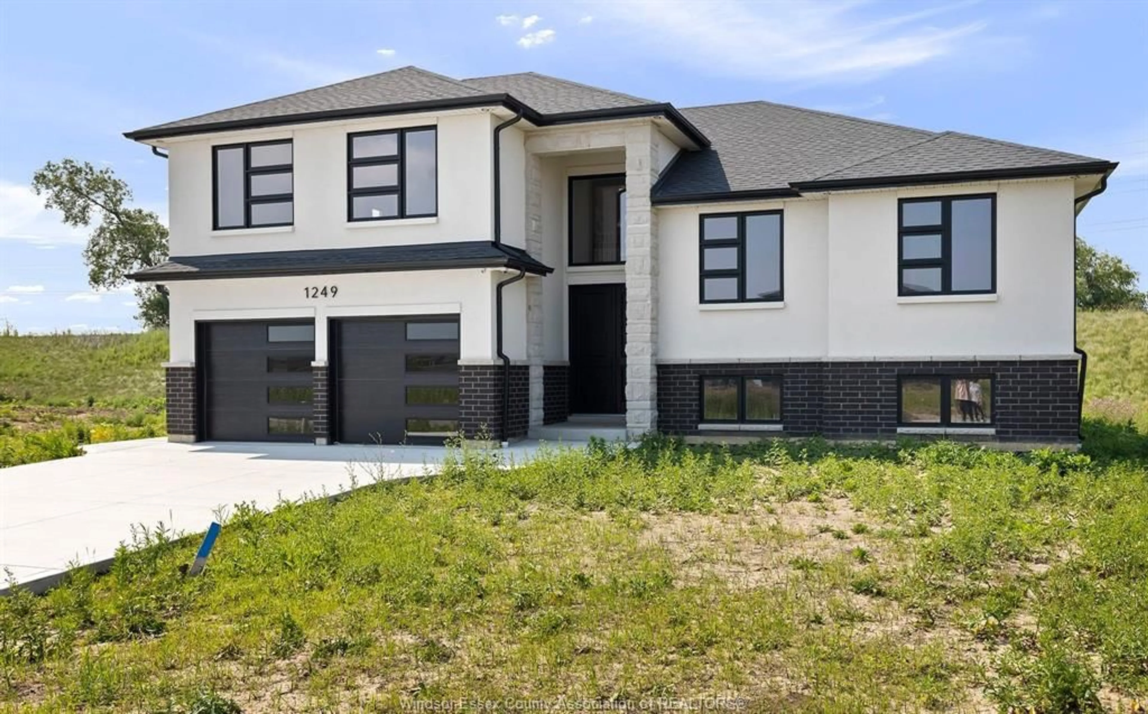 Home with brick exterior material, street for 1247 CAMPANA Cres, Lakeshore Ontario N8L 0K4