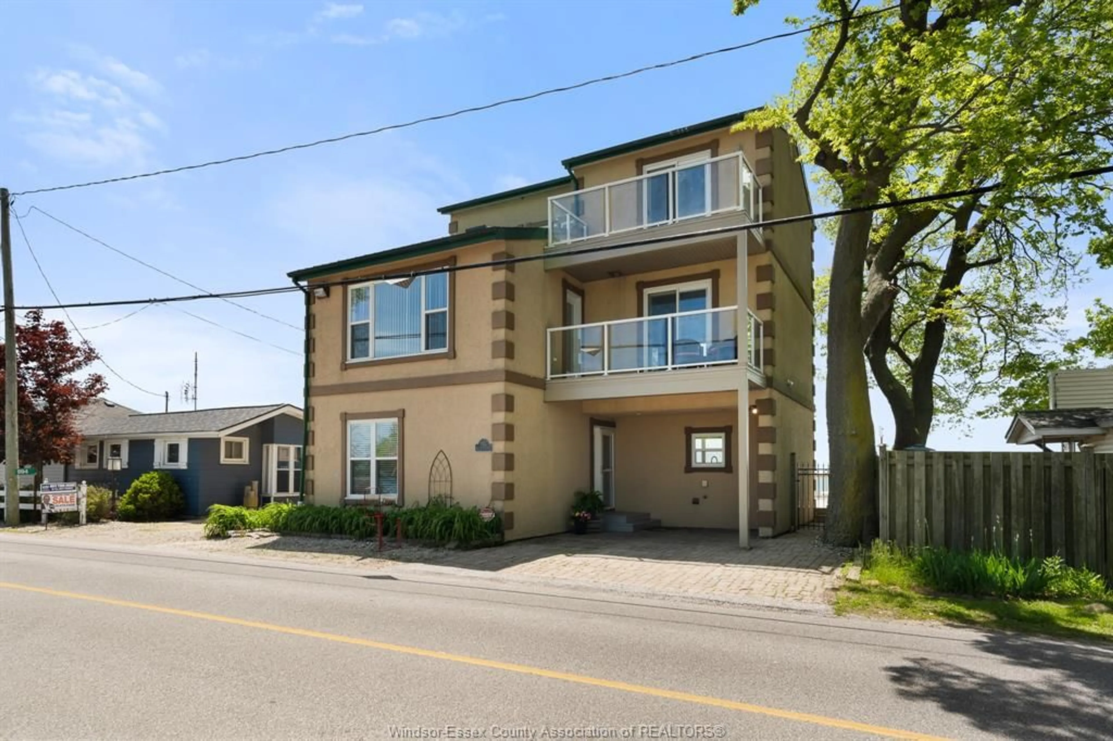 A pic from outside/outdoor area/front of a property/back of a property/a pic from drone, street for 992 Pt. Pelee Dr, Leamington Ontario N8H 3V4