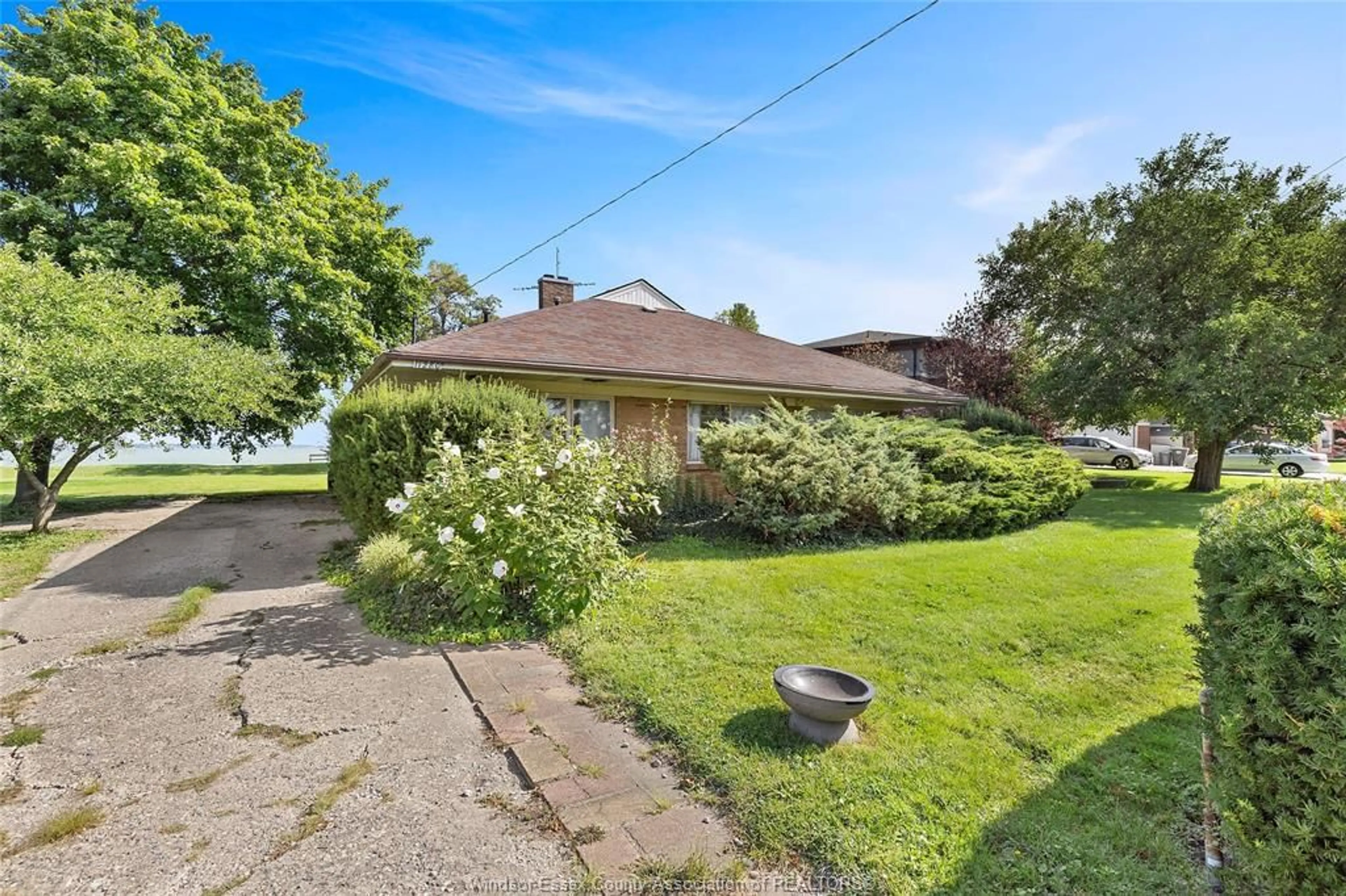 A pic from outside/outdoor area/front of a property/back of a property/a pic from drone, street for 11280 RIVERSIDE Dr, Windsor Ontario N8P 1A4