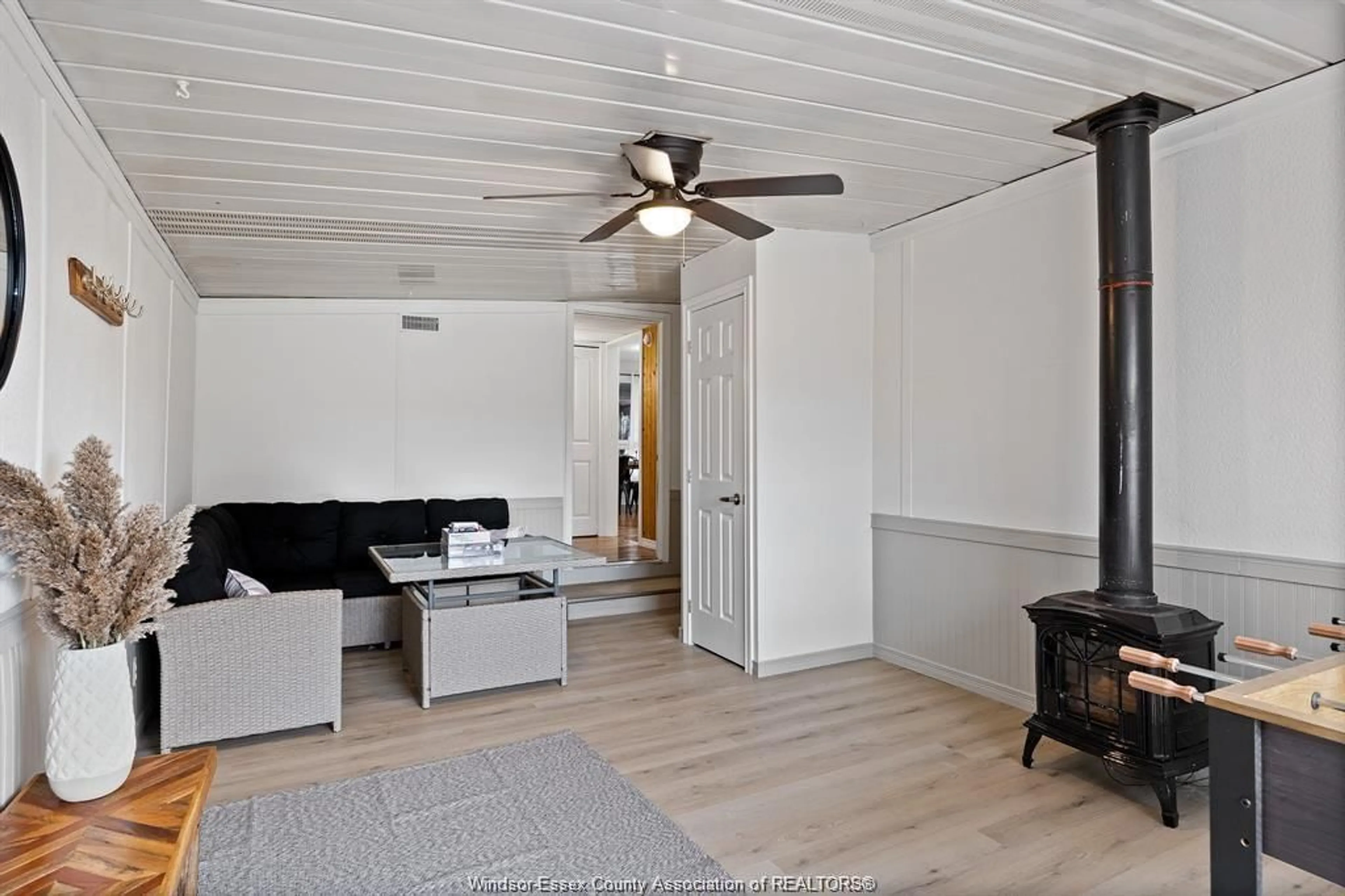 Living room with furniture, wood/laminate floor for 166 STIRLING St, Lakeshore Ontario N0R 1A0