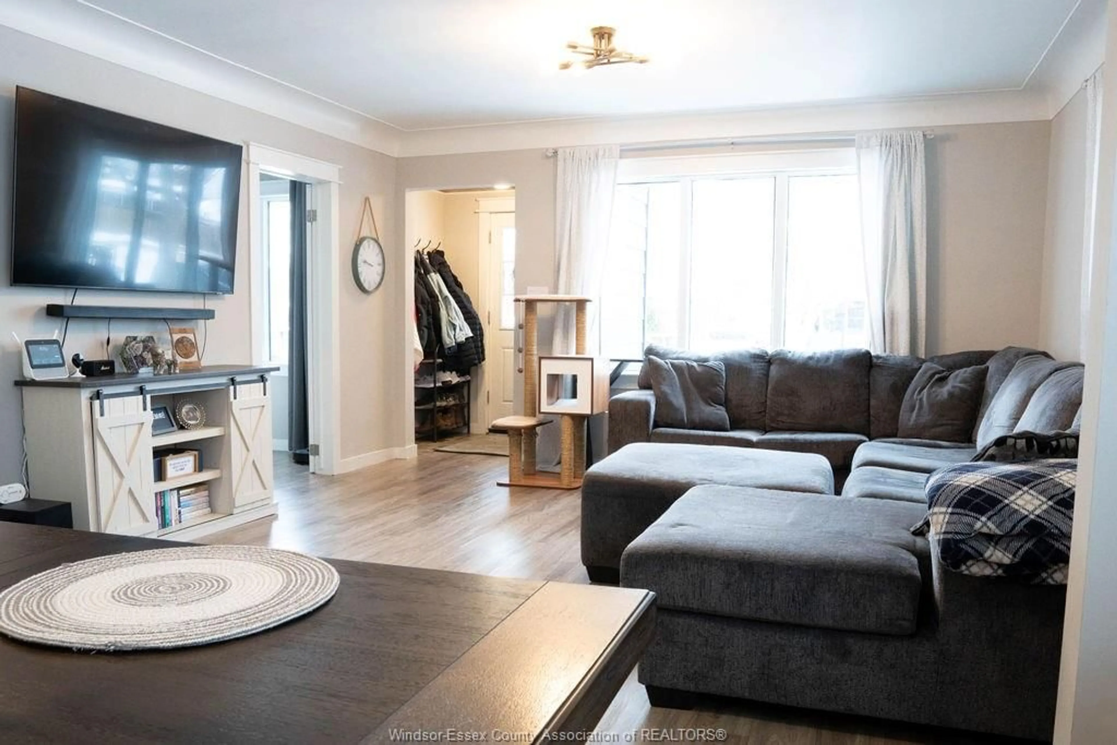 Living room with furniture, wood/laminate floor for 2334 Highland, Windsor Ontario N8X 3S5