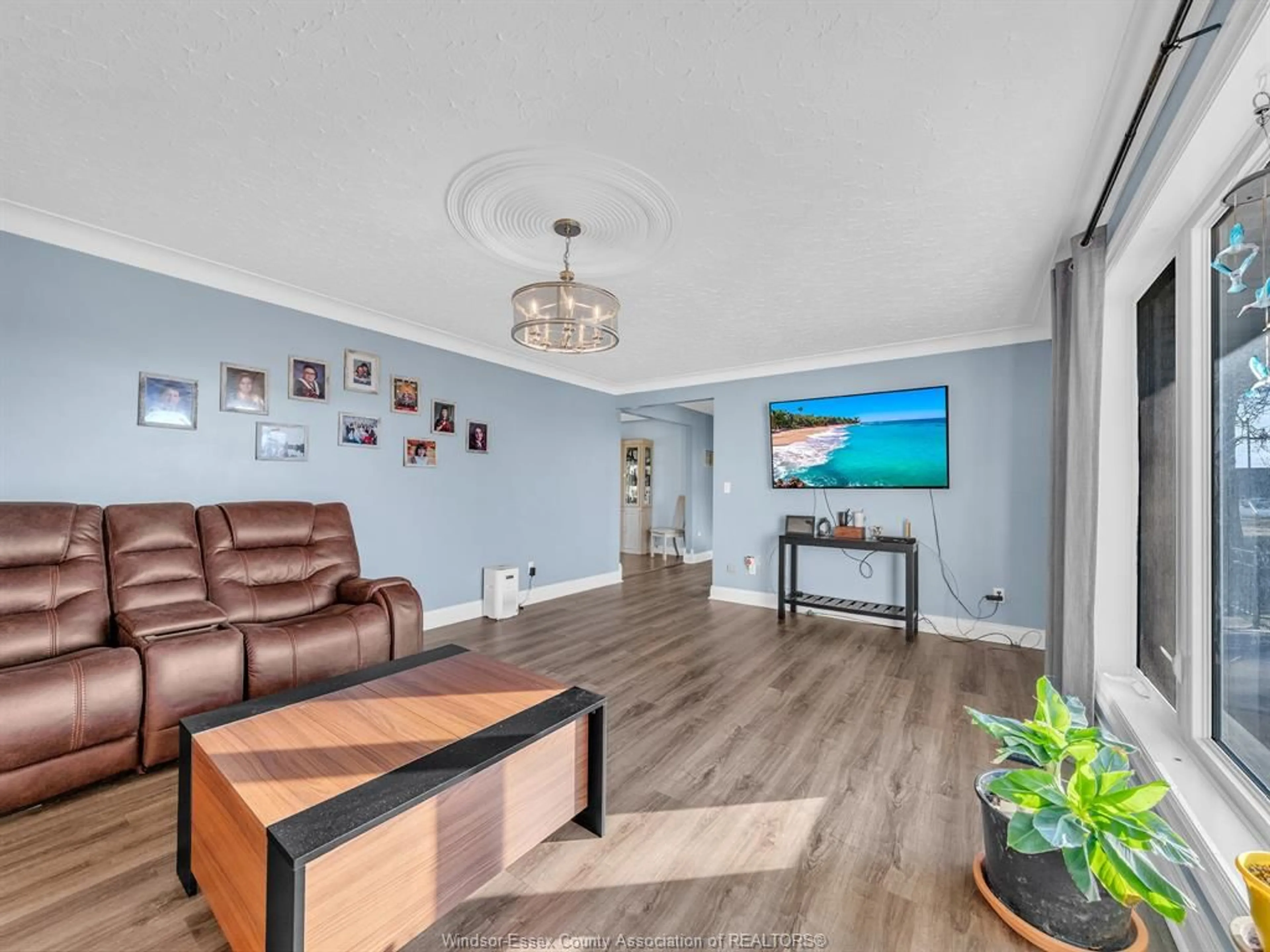 Living room with furniture, wood/laminate floor for 1502 Road 4 East, Ruthven Ontario N0P 2G0