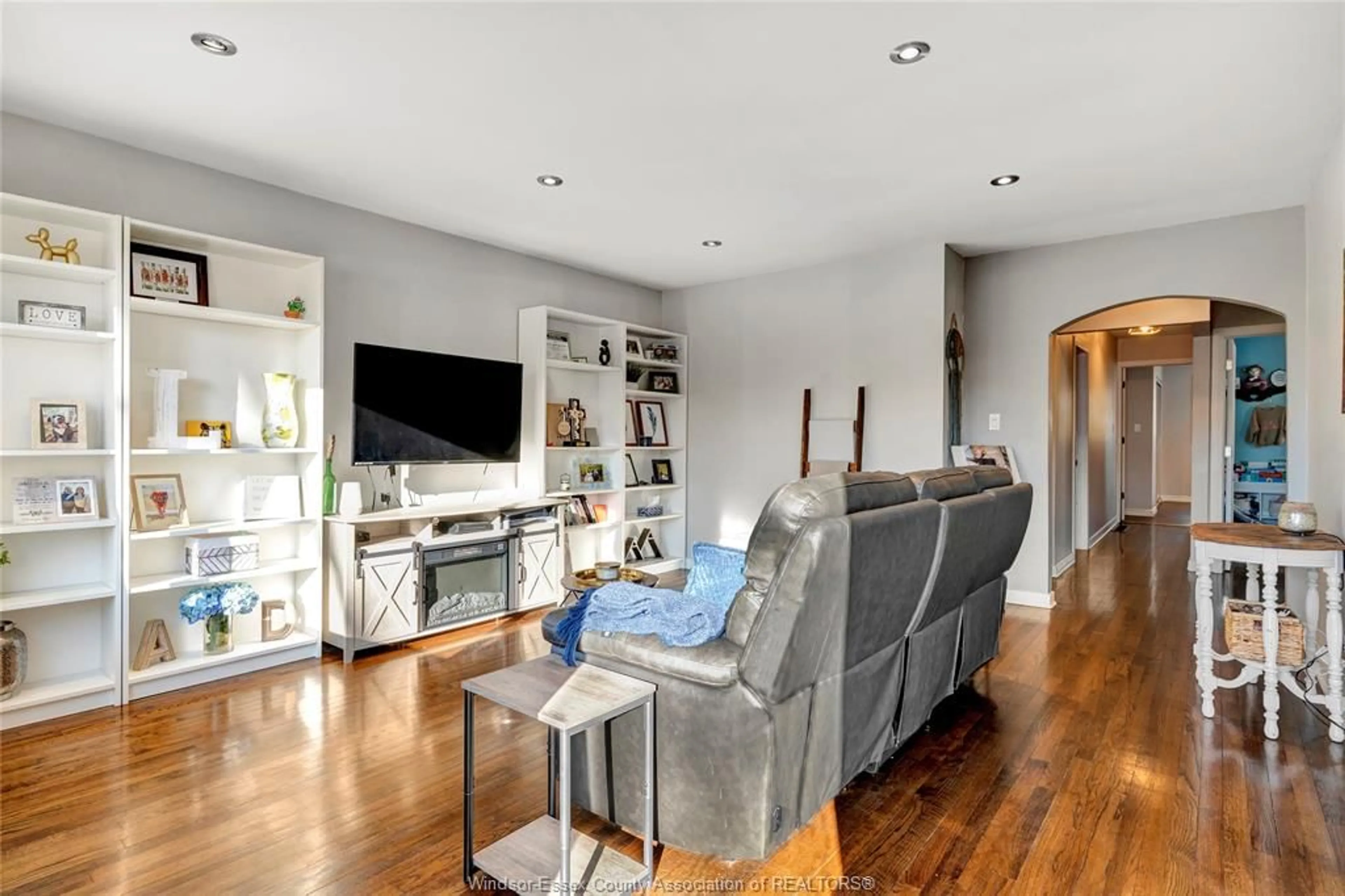 Living room with furniture, wood/laminate floor for 2572 TOURANGEAU Rd, Windsor Ontario N8W 4N9