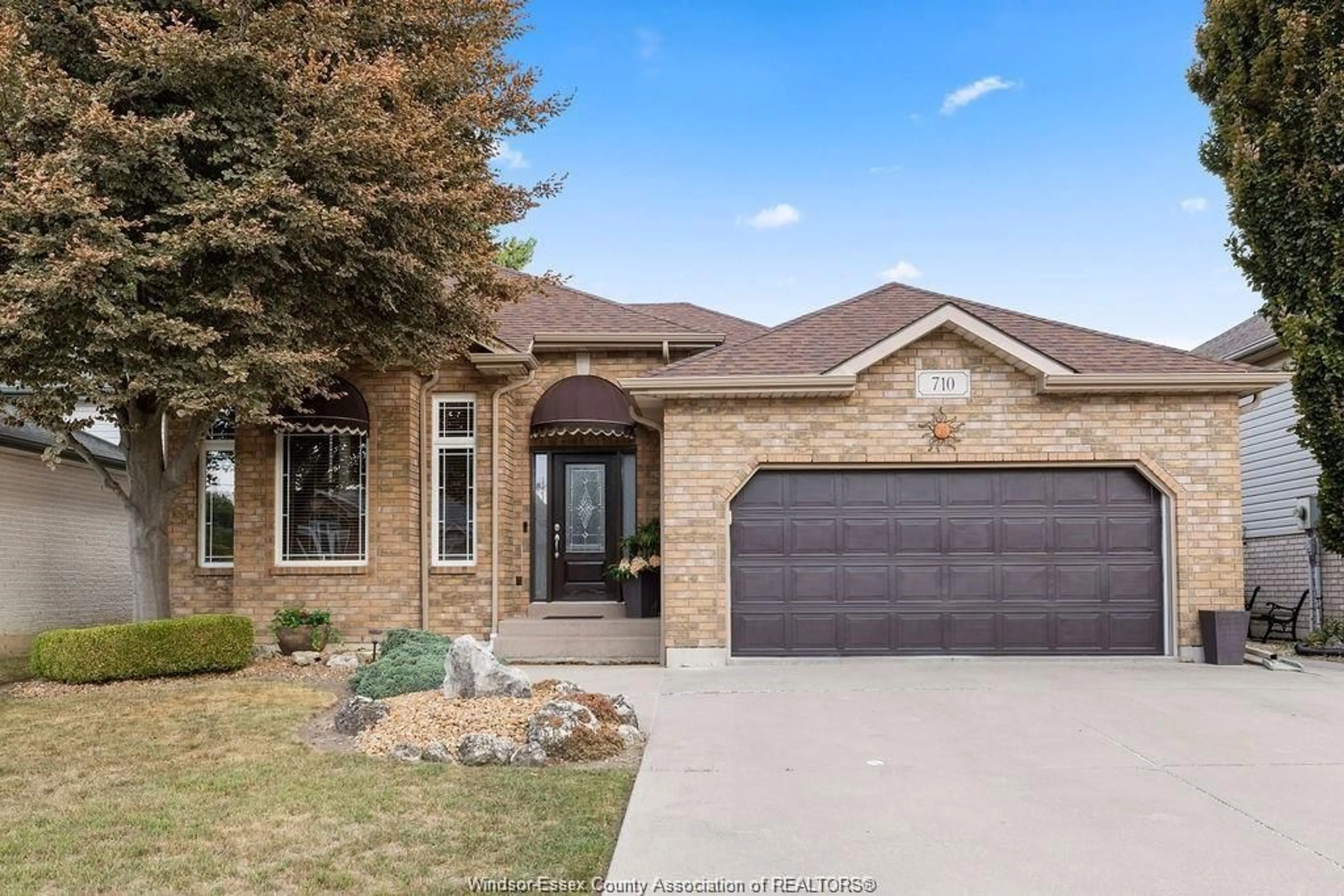 Home with brick exterior material, street for 710 REVLAND Dr, Tecumseh Ontario N8N 5B1