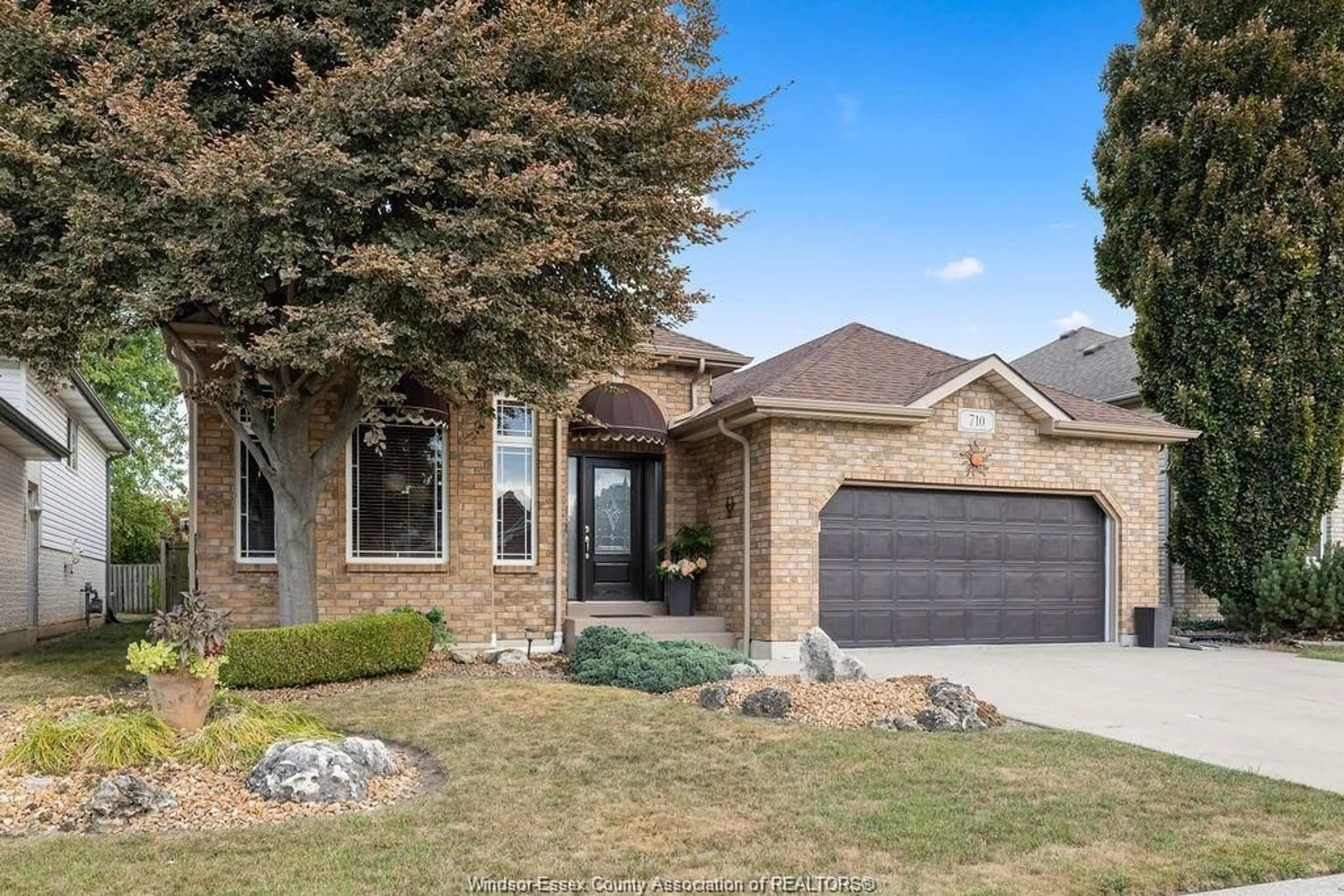 Home with brick exterior material, street for 710 REVLAND Dr, Tecumseh Ontario N8N 5B1