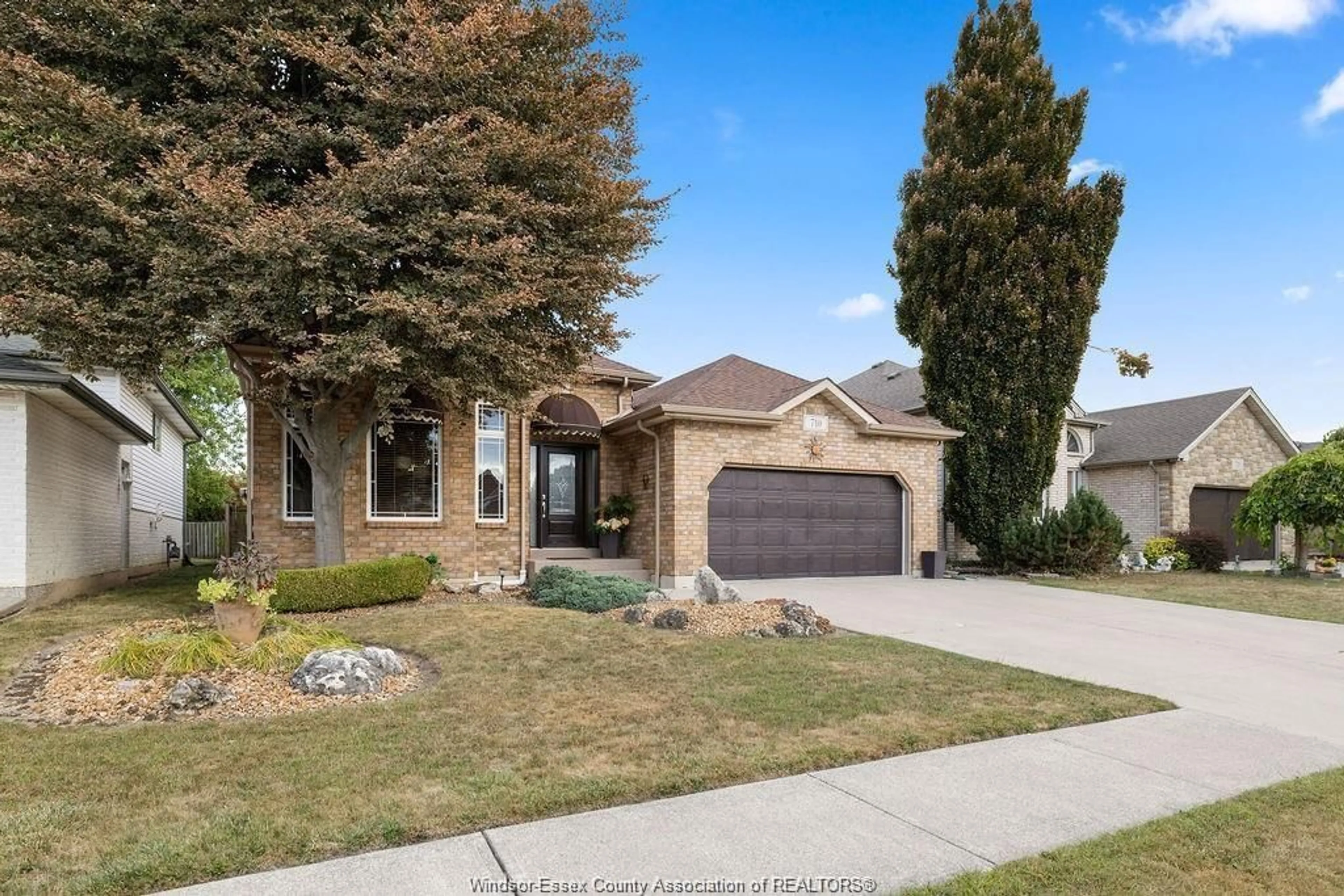 Home with brick exterior material, street for 710 REVLAND Dr, Tecumseh Ontario N8N 5B1