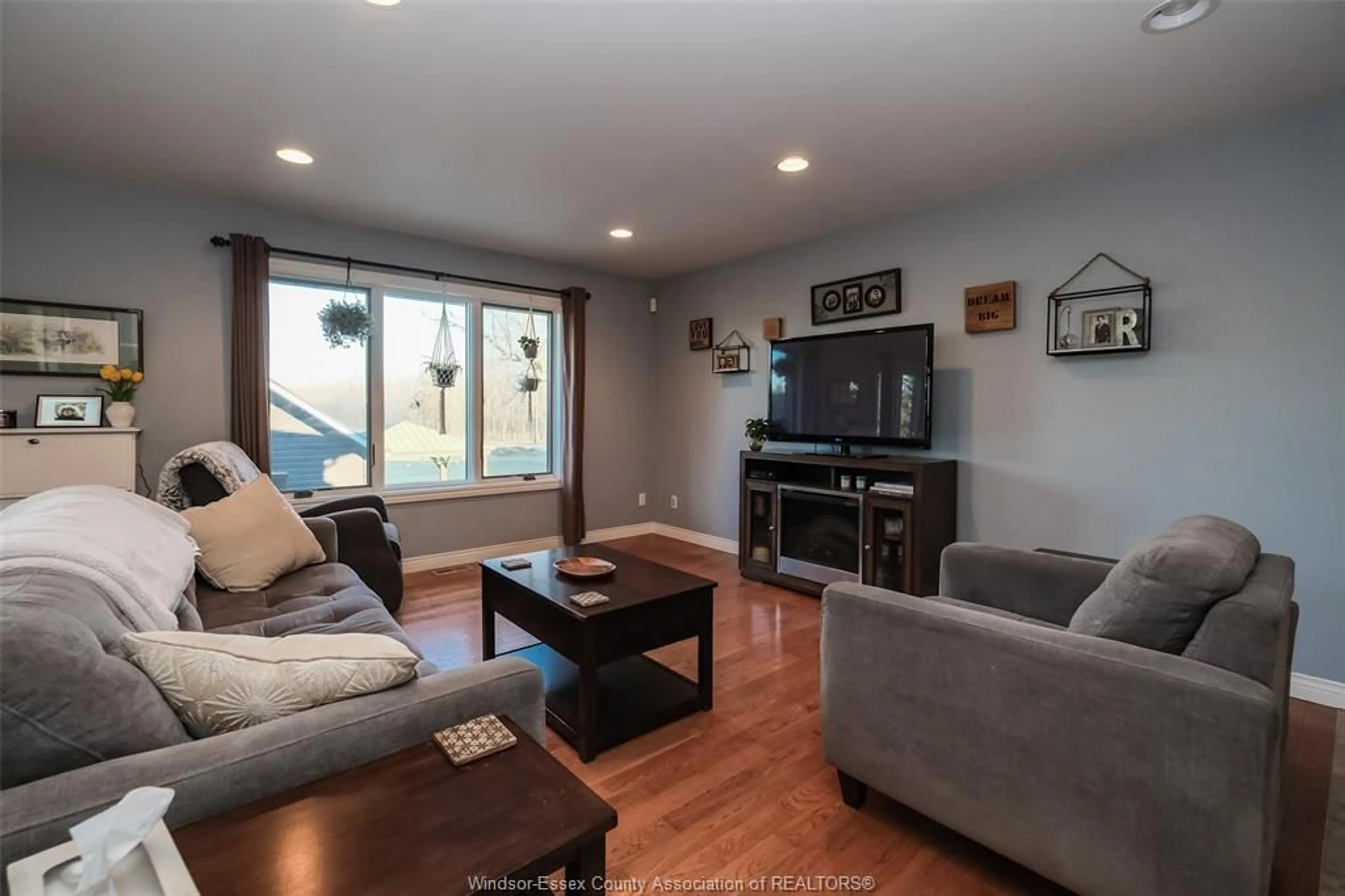 Living room with furniture, wood/laminate floor for 8470 MALDEN, LaSalle Ontario N9J 2V7