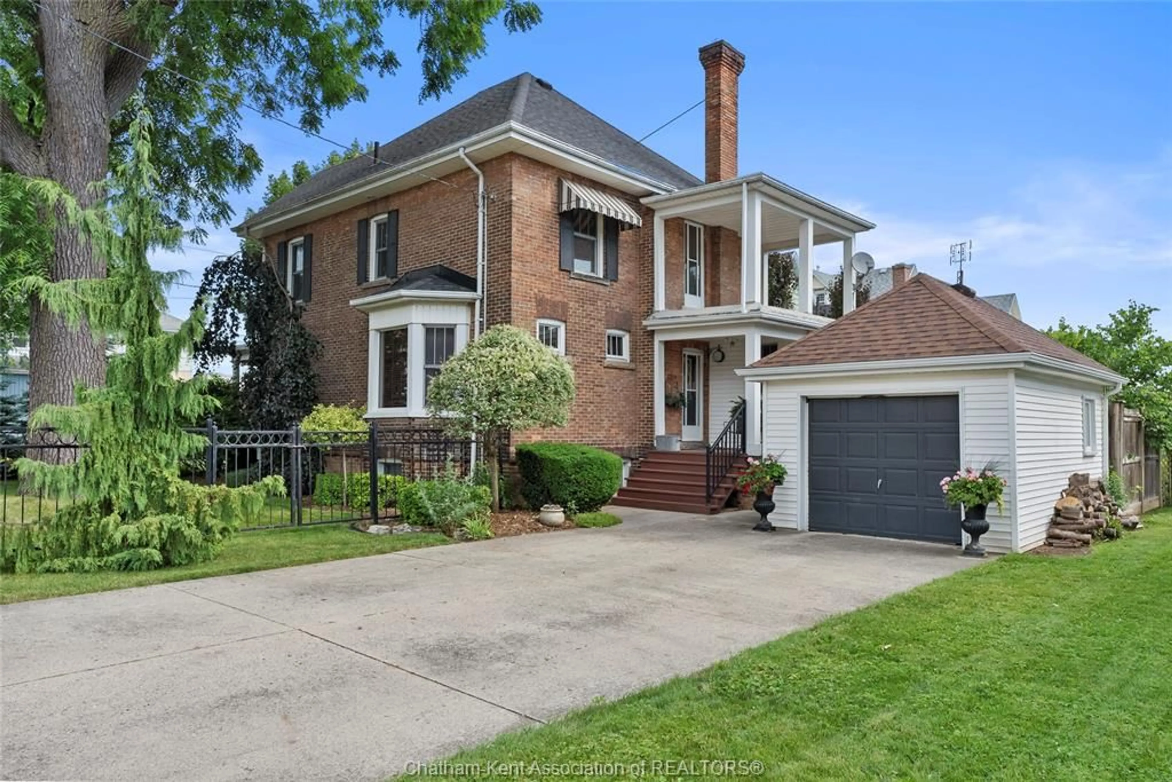 Home with brick exterior material, street for 52 Cross St, Chatham Ontario N7M 1K7