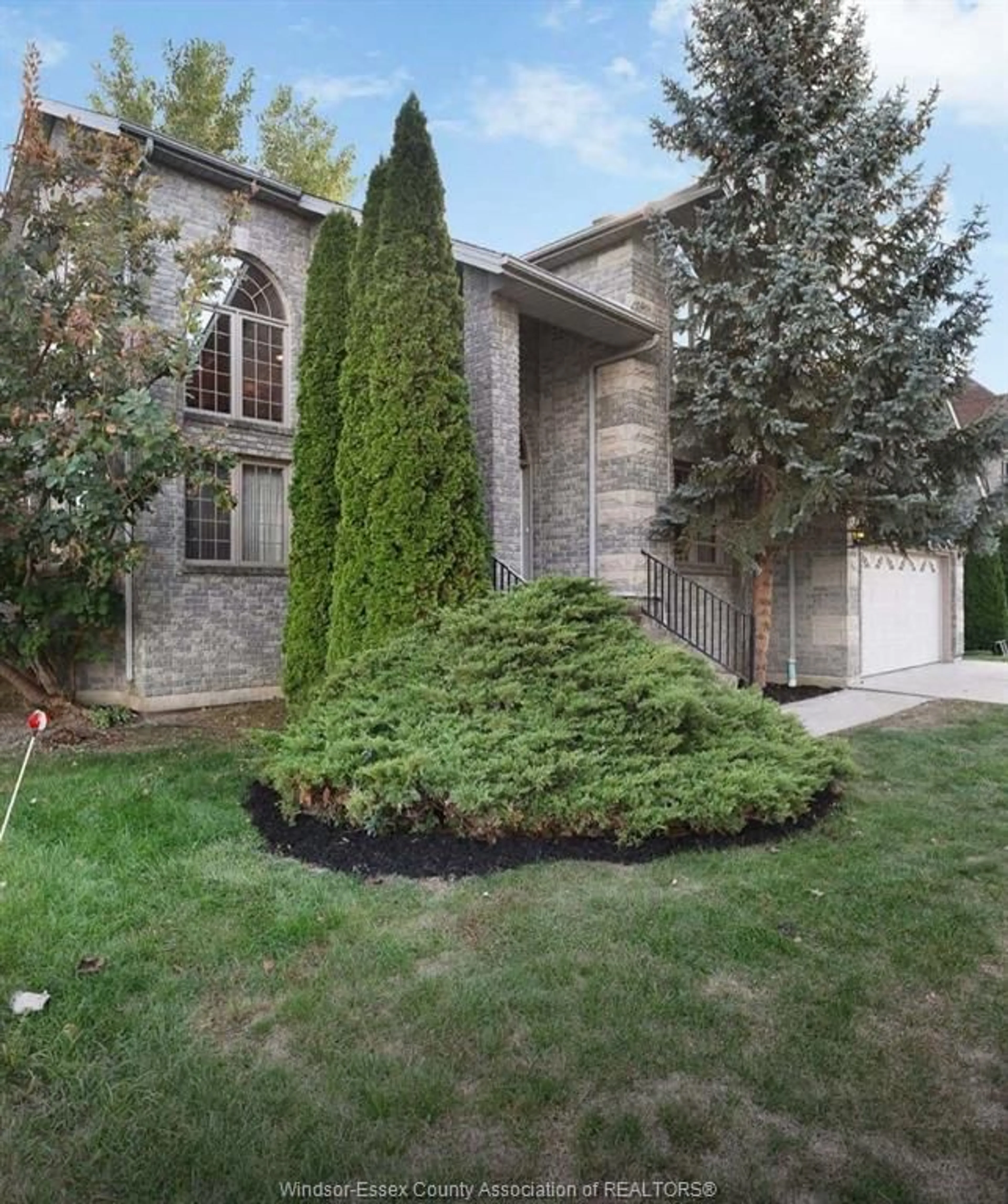 Home with brick exterior material, street for 11363 AMALFI Dr, Windsor Ontario N8P 1J8