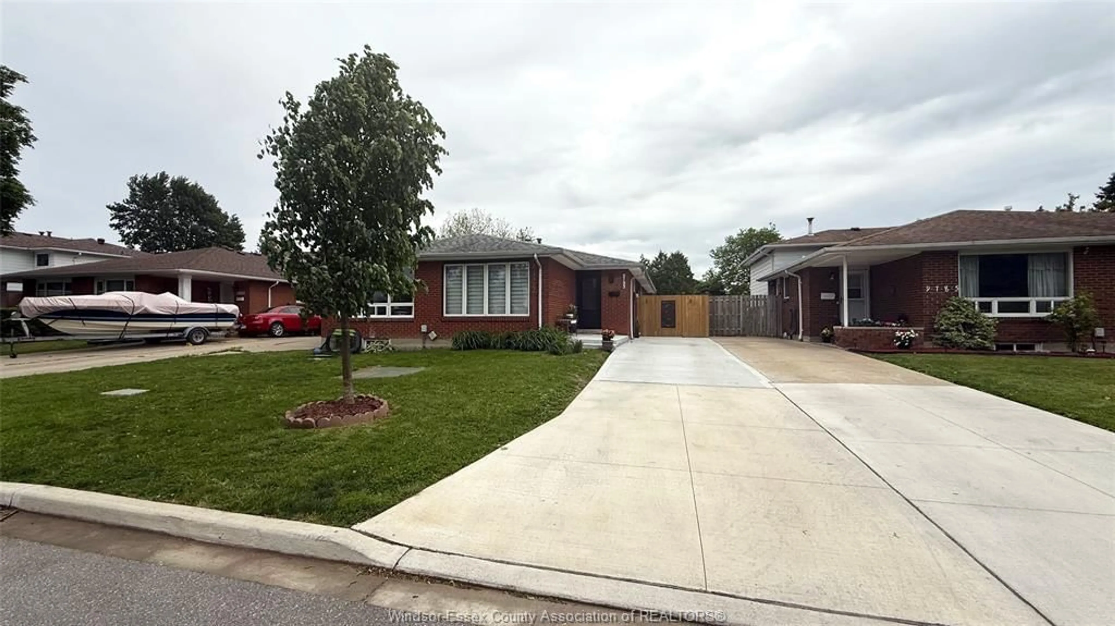 Home with brick exterior material, street for 9793 LYNNGROVE Cres, Windsor Ontario N8R 1B8