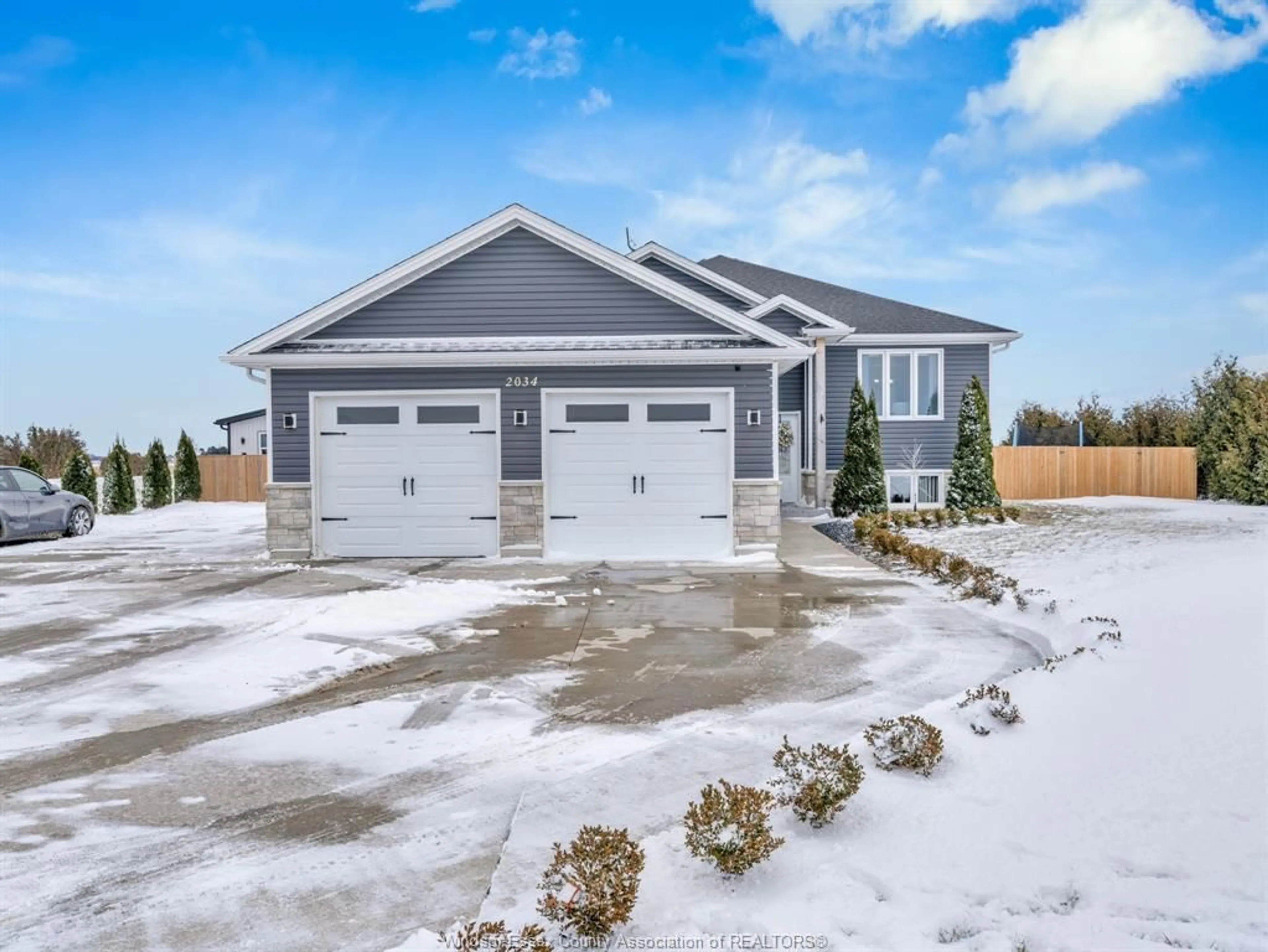 Home with vinyl exterior material, street for 2034 Mersea Road 7, Leamington Ontario N0P 2P0