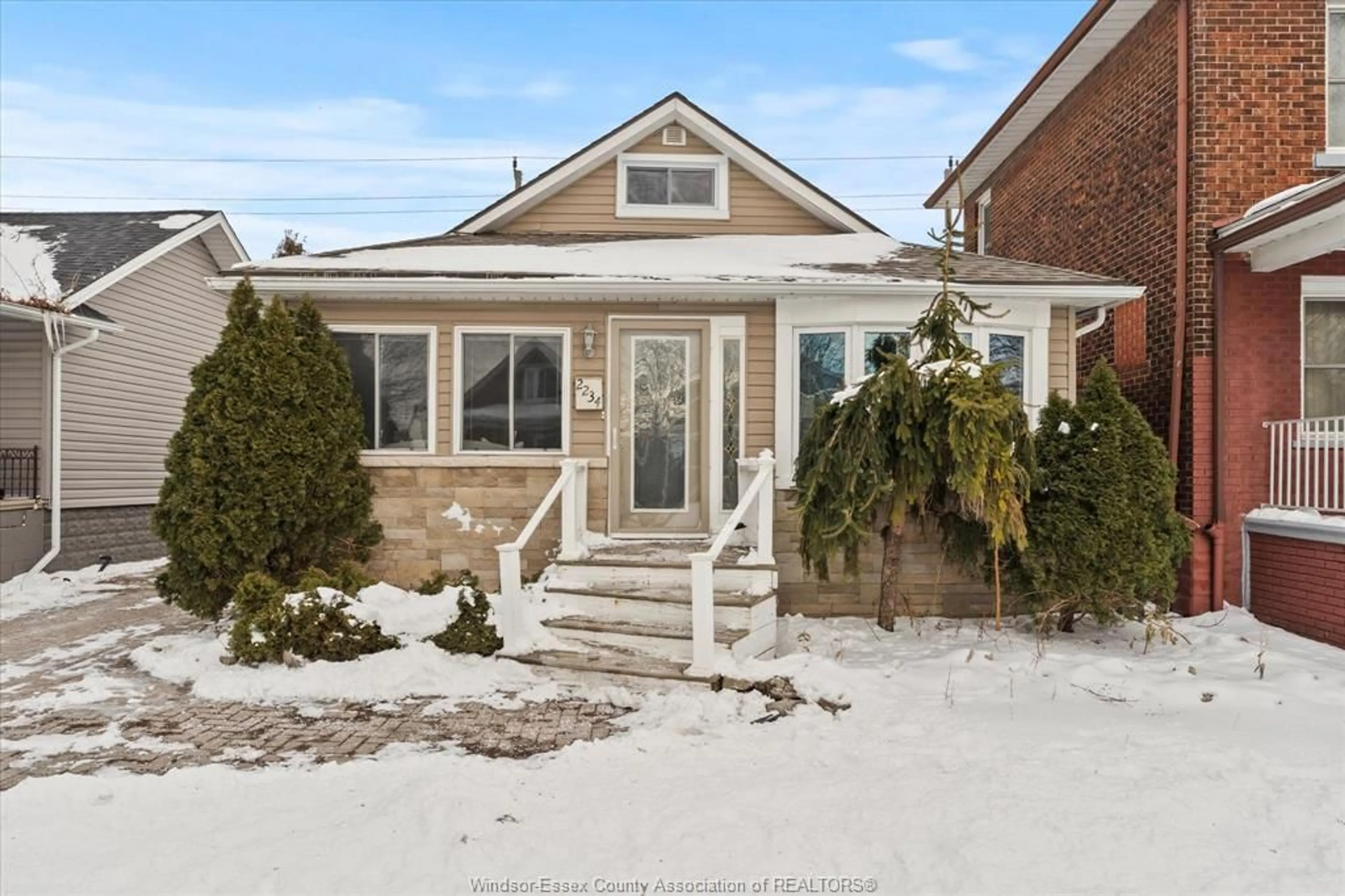 Home with brick exterior material, street for 2234 Highland, Windsor Ontario N8X 3S4