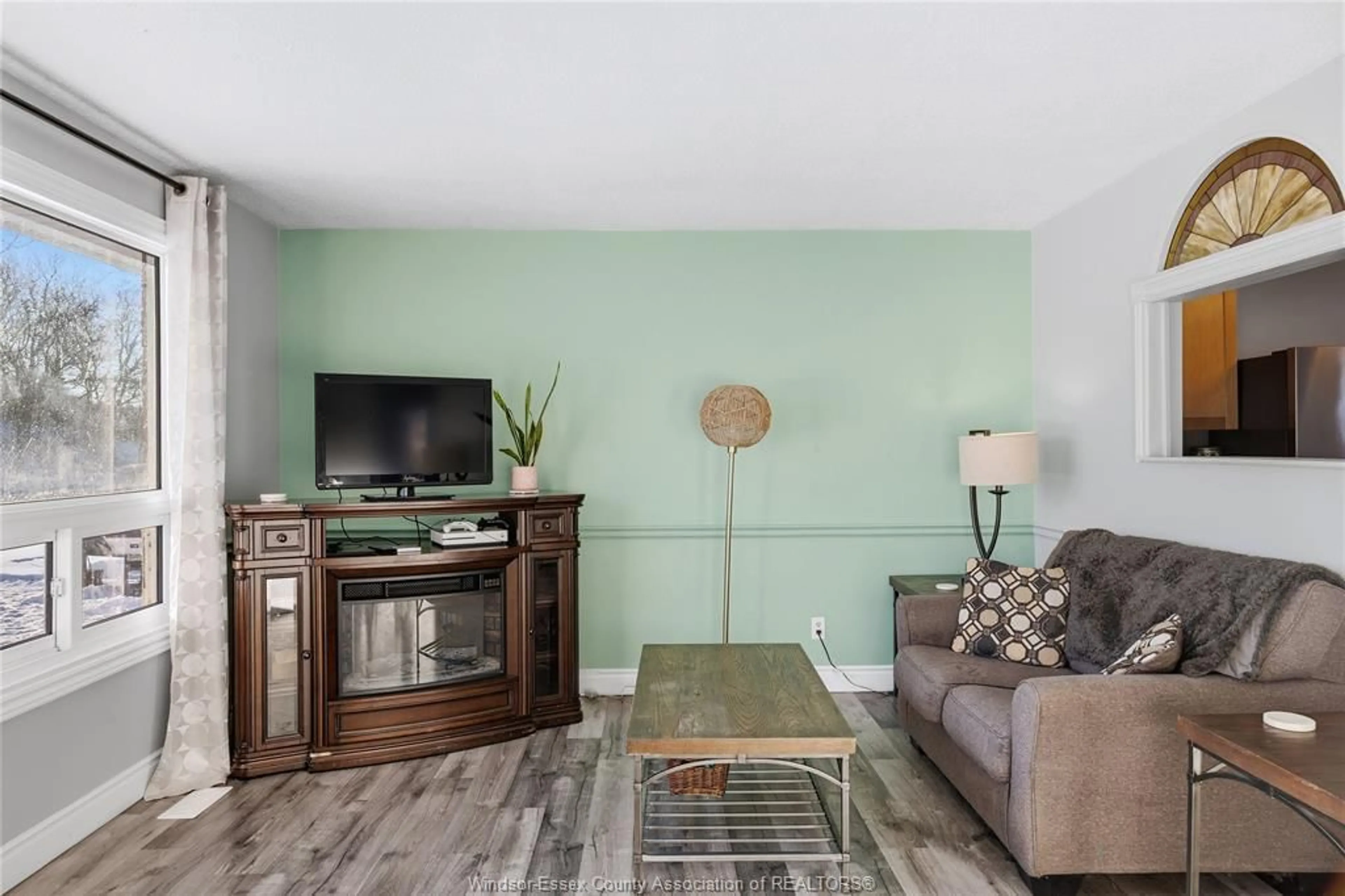Living room with furniture, wood/laminate floor for 279 Pacific Ave, Amherstburg Ontario N9V 3E7