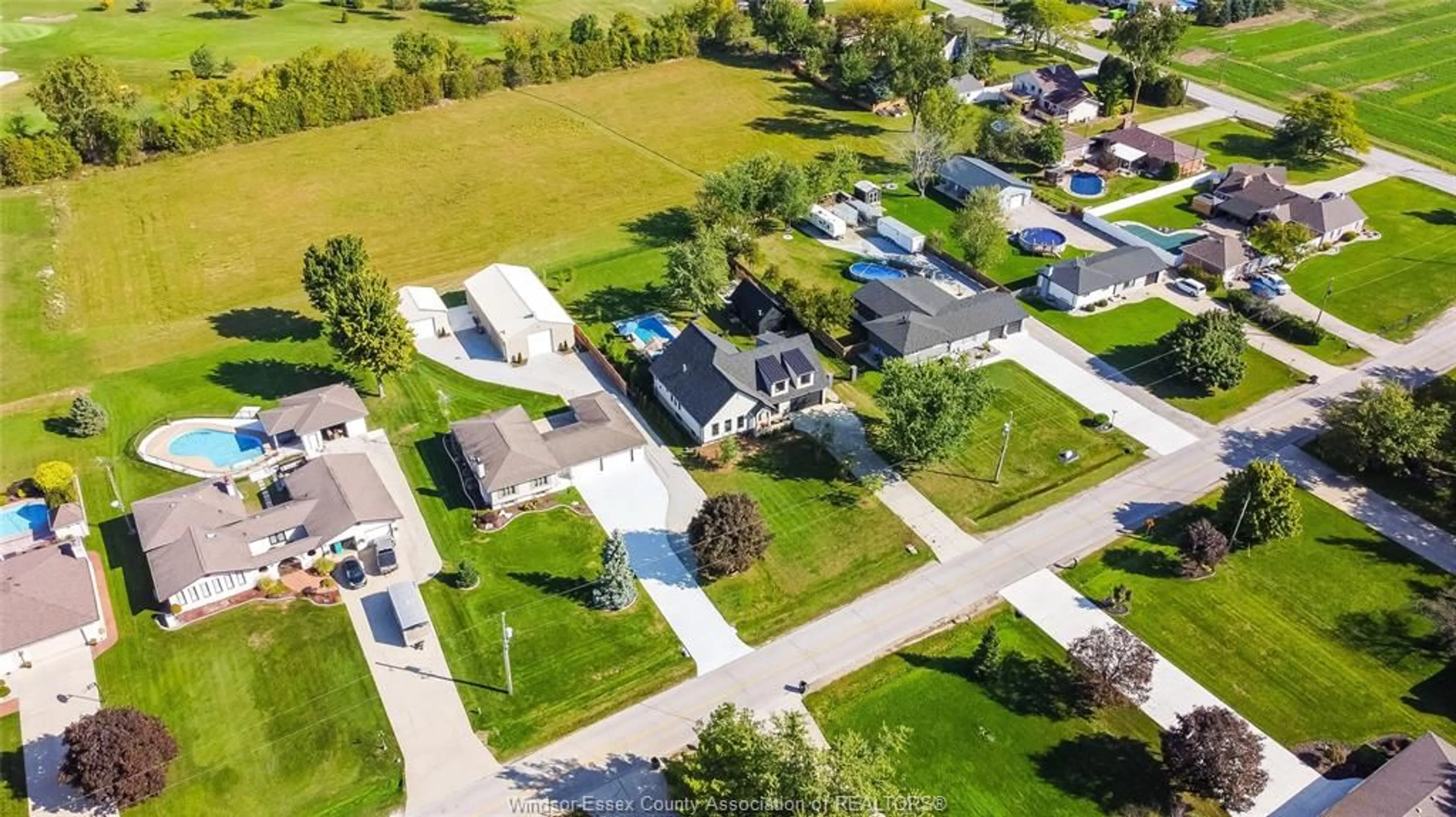 A pic from outside/outdoor area/front of a property/back of a property/a pic from drone, street for 77 BISSONNETTE Lane, Lakeshore Ontario N0R 1V0
