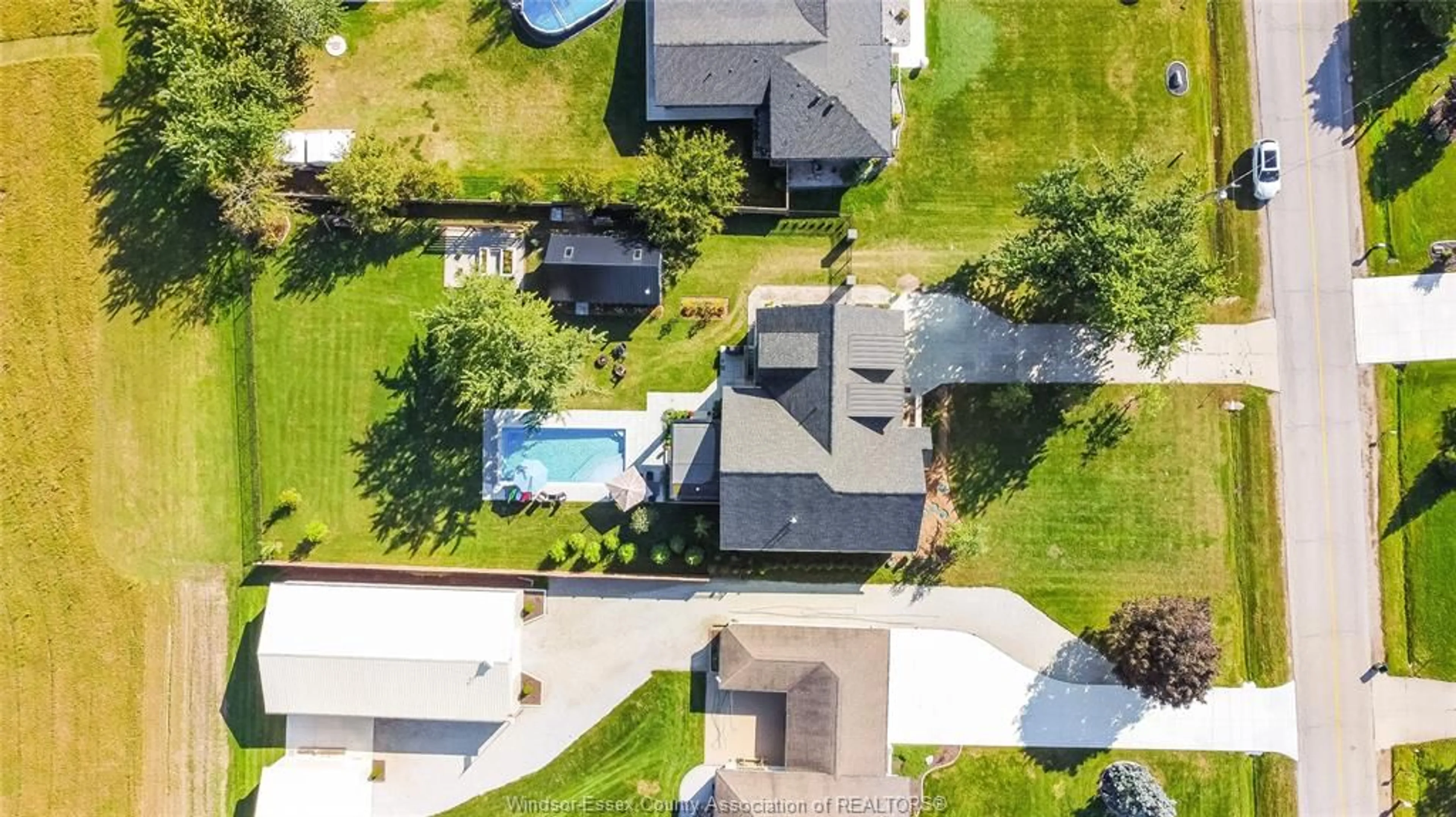 A pic from outside/outdoor area/front of a property/back of a property/a pic from drone, street for 77 BISSONNETTE Lane, Lakeshore Ontario N0R 1V0