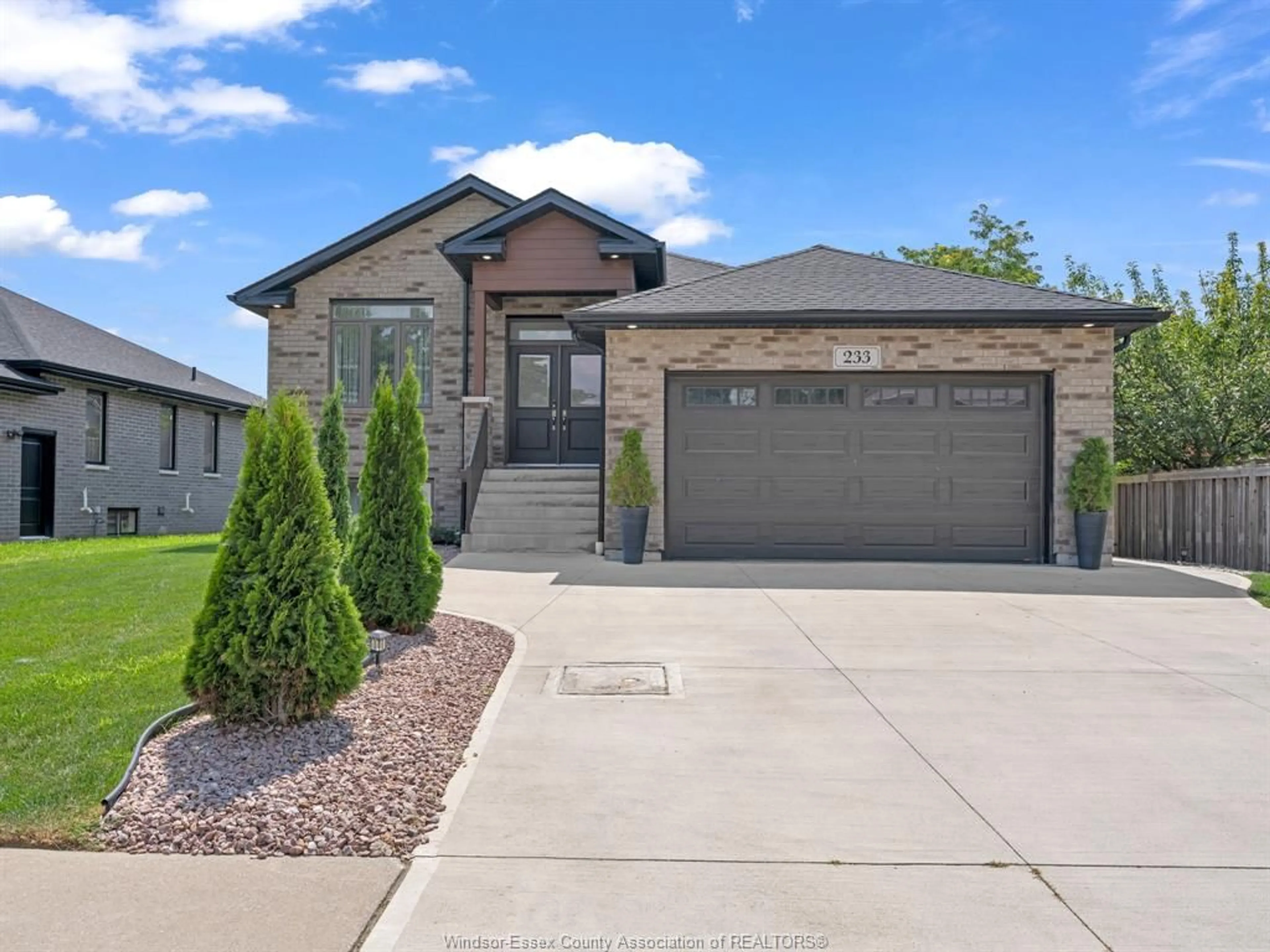 Home with brick exterior material, street for 233 Sandybrook Way, Kingsville Ontario N9Y 0A3