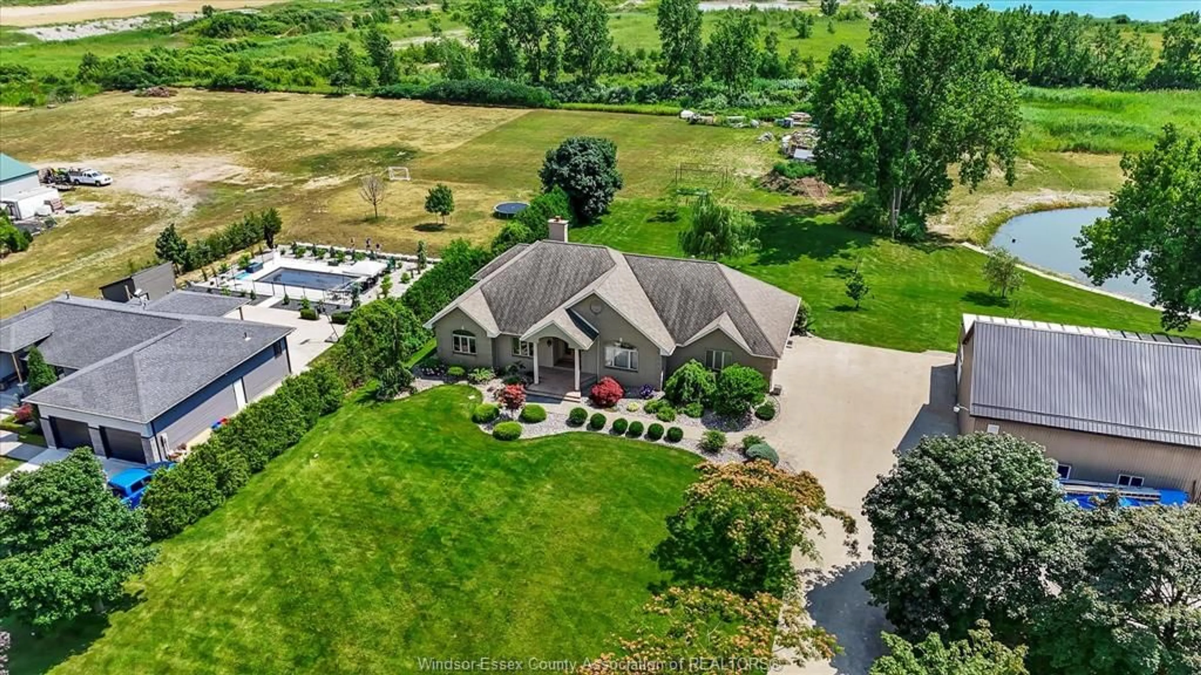 A pic from outside/outdoor area/front of a property/back of a property/a pic from drone, unknown for 210 Mersea 3, Leamington Ontario N8H 3V5