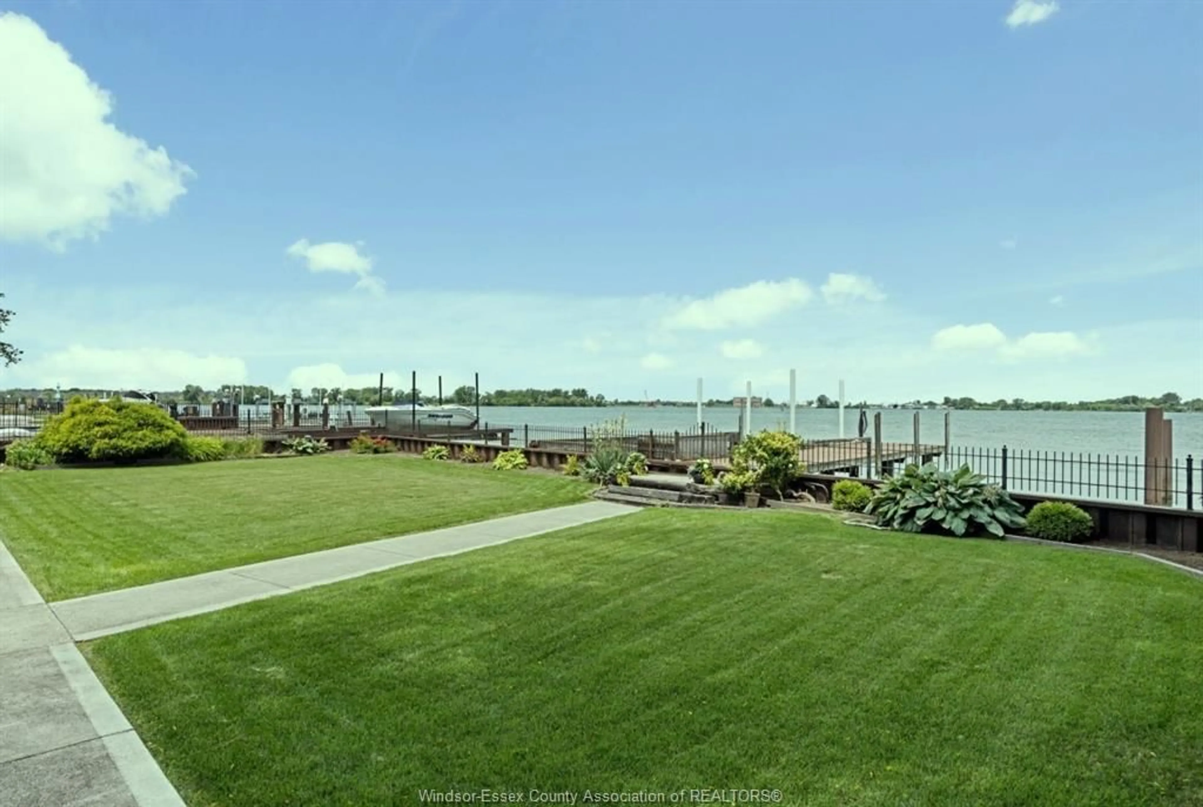 A pic from outside/outdoor area/front of a property/back of a property/a pic from drone, water/lake/river/ocean view for 8280 Riverside Dr, Windsor Ontario N8S 1E6