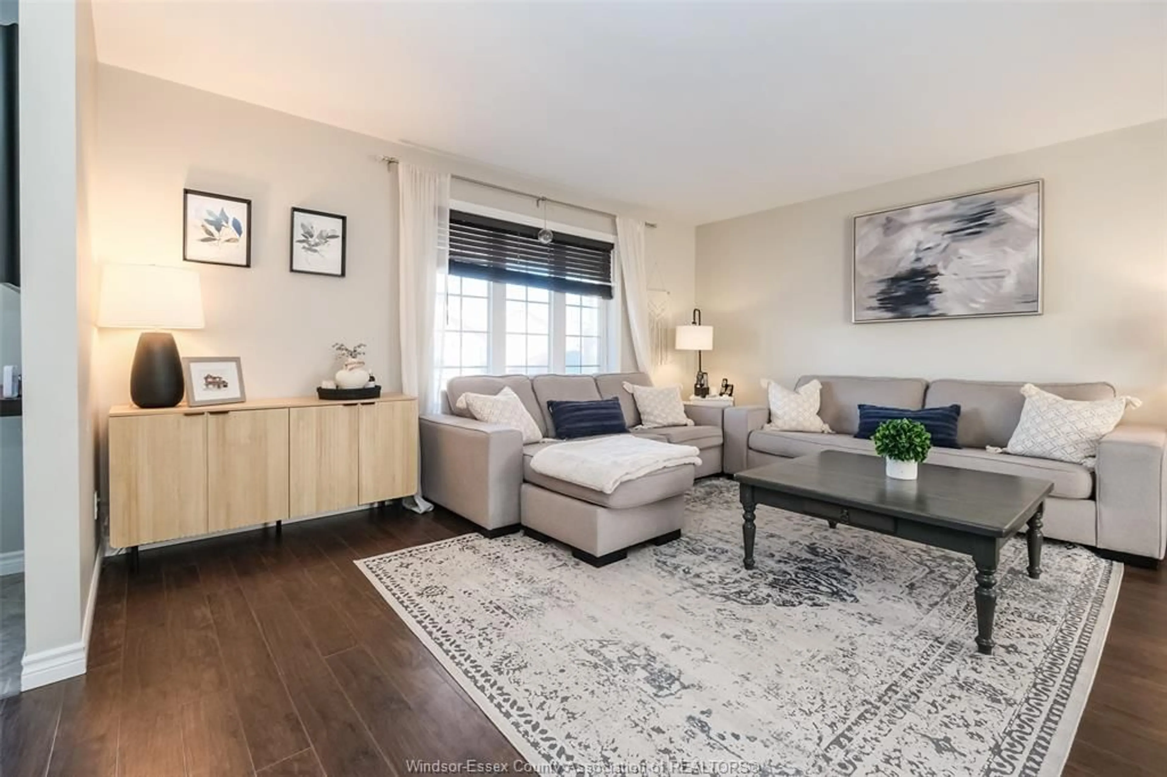 Living room with furniture, wood/laminate floor for 1013 TREVERTON, Windsor Ontario N8P 1K2