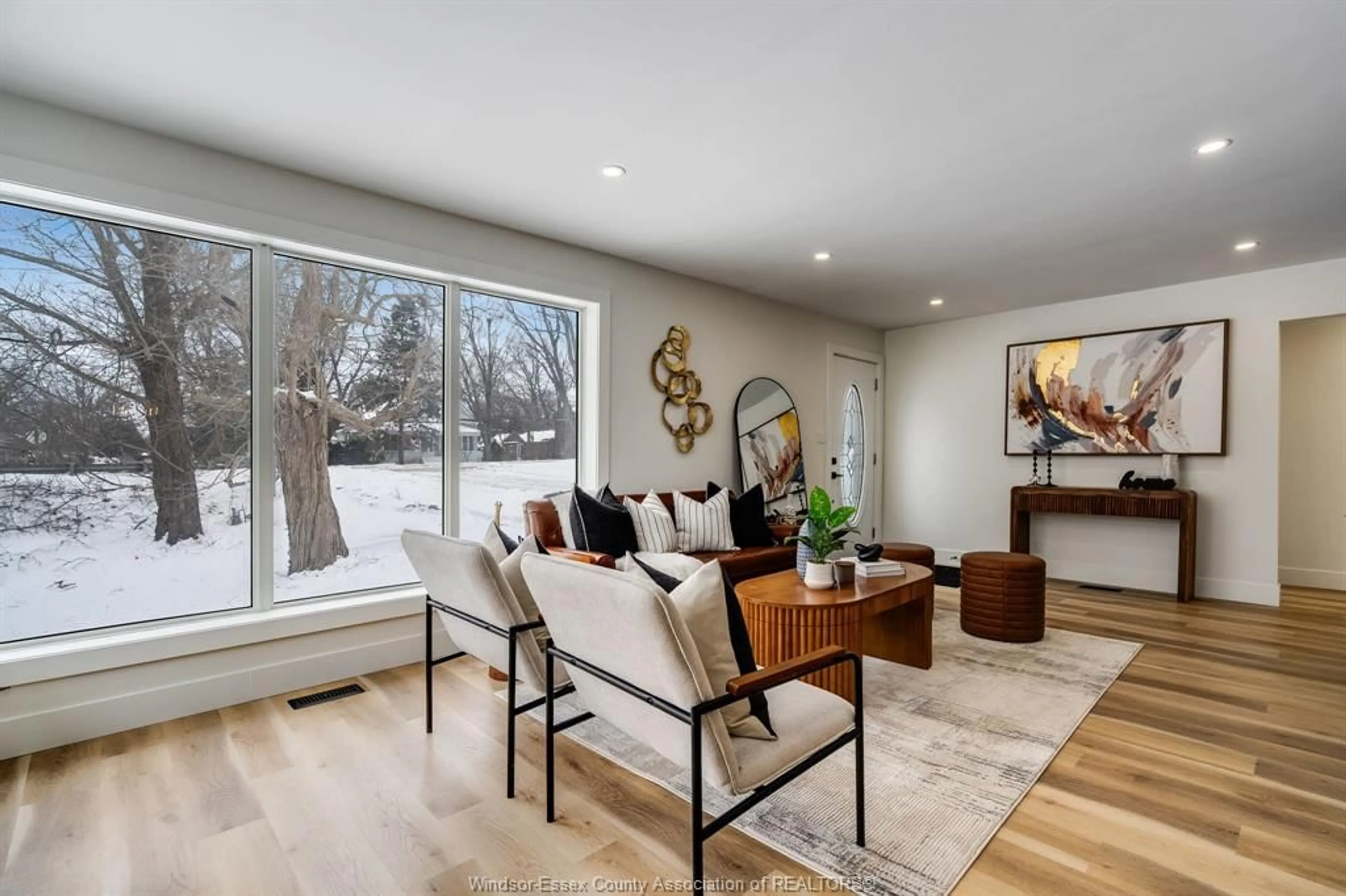 Living room with furniture, wood/laminate floor for 1838 Seacliff Dr, Kingsville Ontario N9Y 2M6