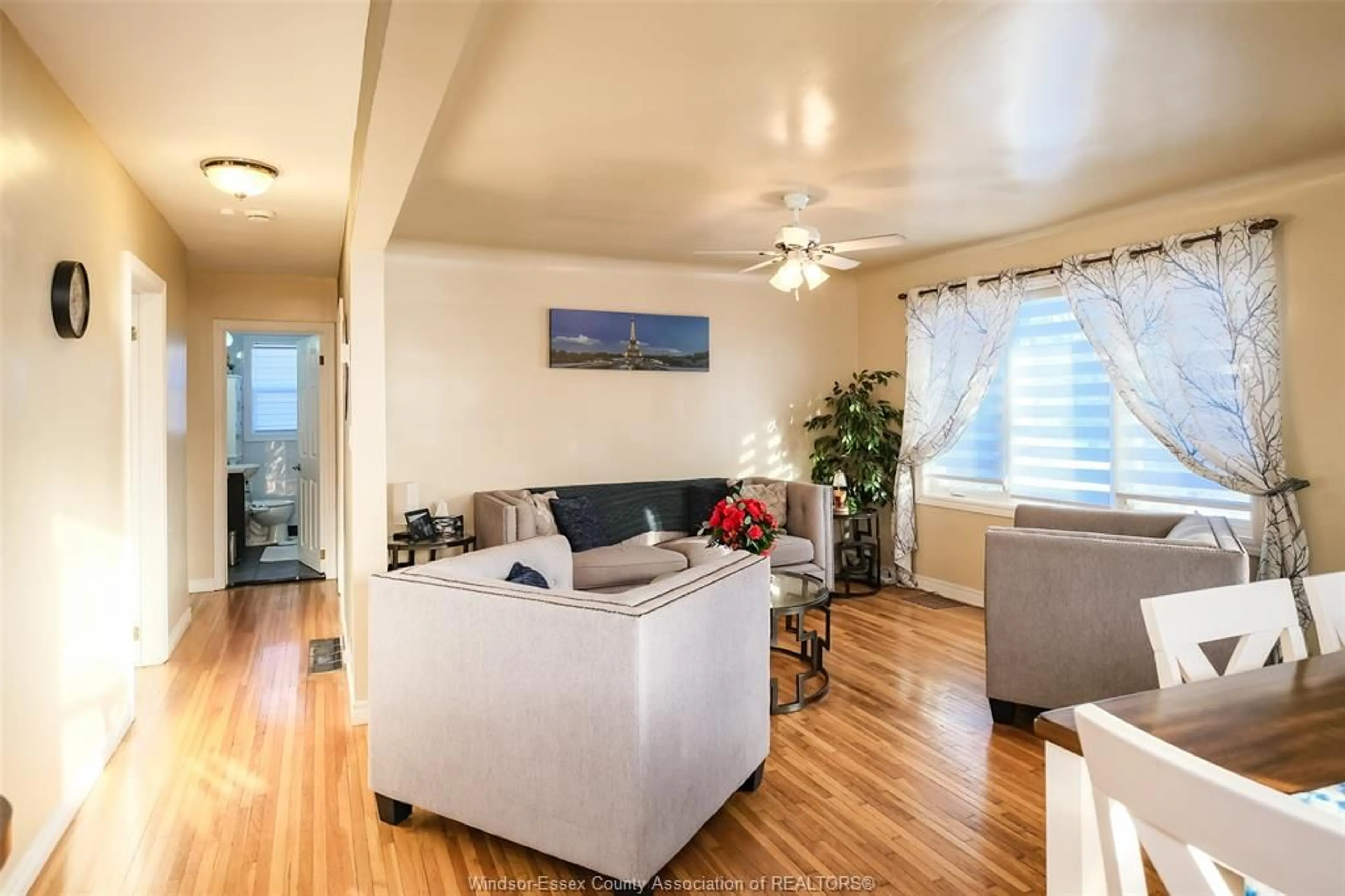 Living room with furniture, wood/laminate floor for 3465 LONGFELLOW, Windsor Ontario N9E 2L8