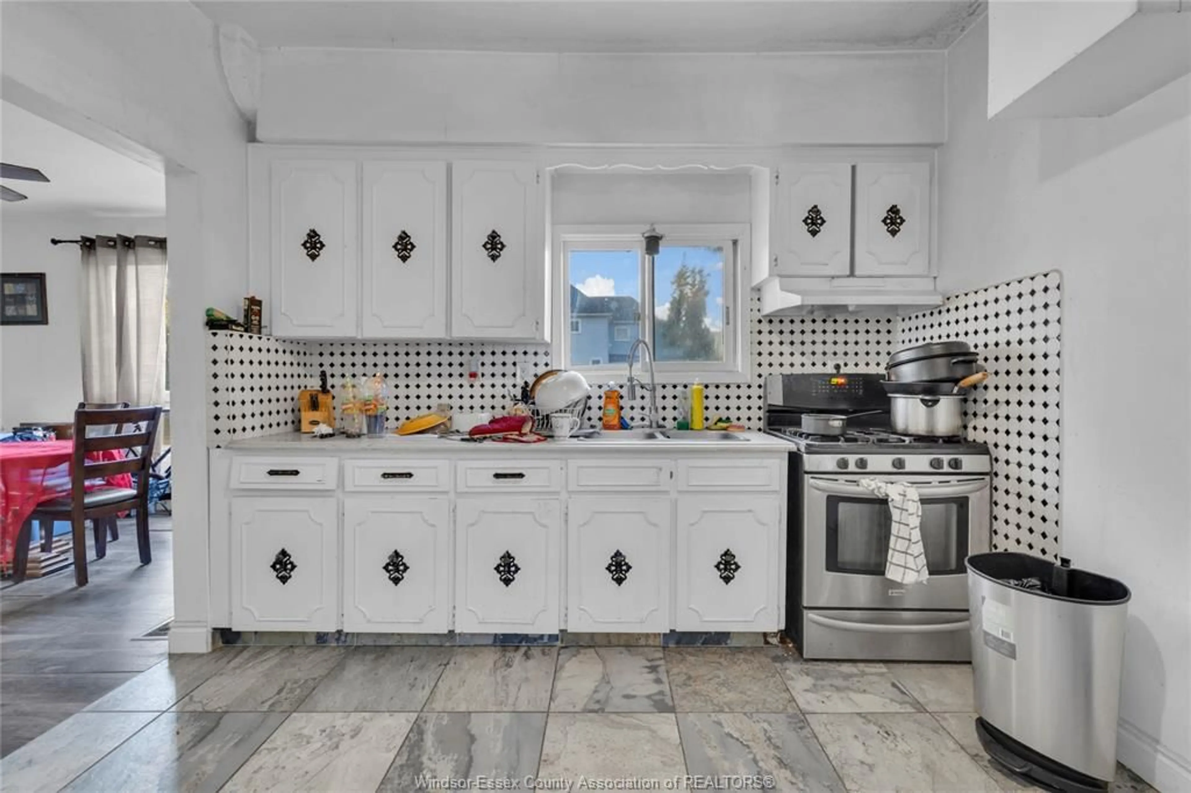 Open concept kitchen, ceramic/tile floor for 304 LANGLOIS Ave, Windsor Ontario N9A 2G1