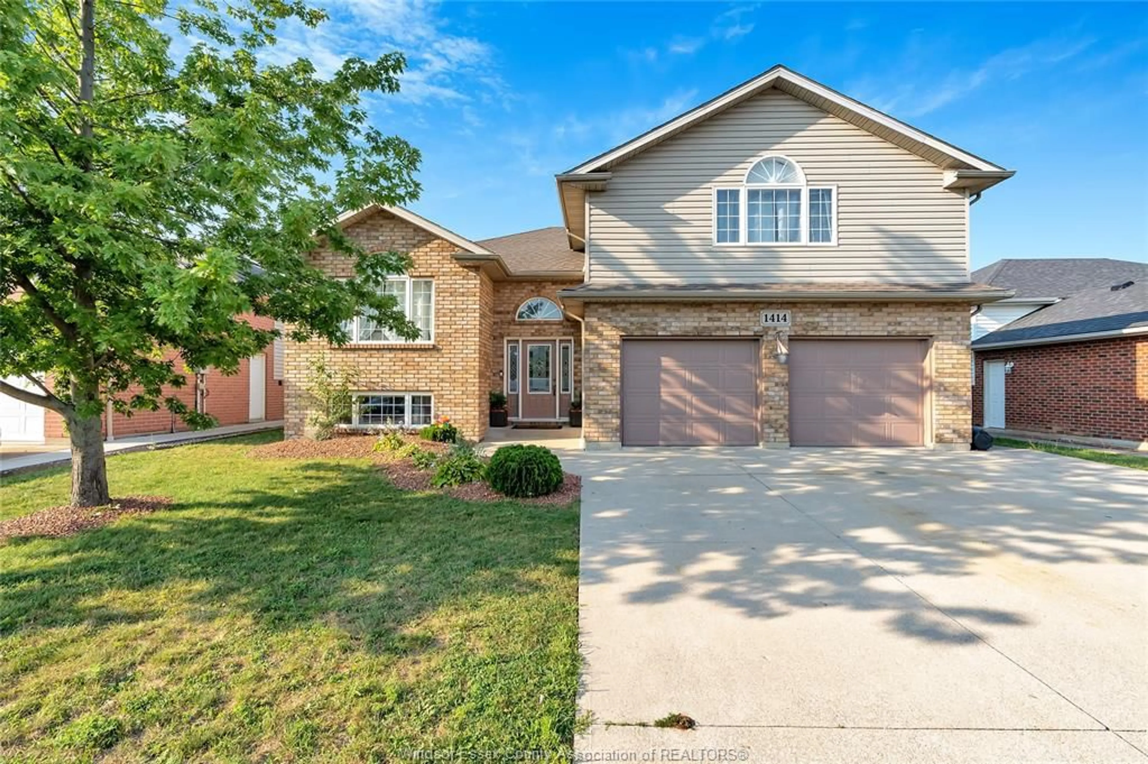 Home with brick exterior material, street for 1414 GIRARD Dr, Lakeshore Ontario N0R 1A0